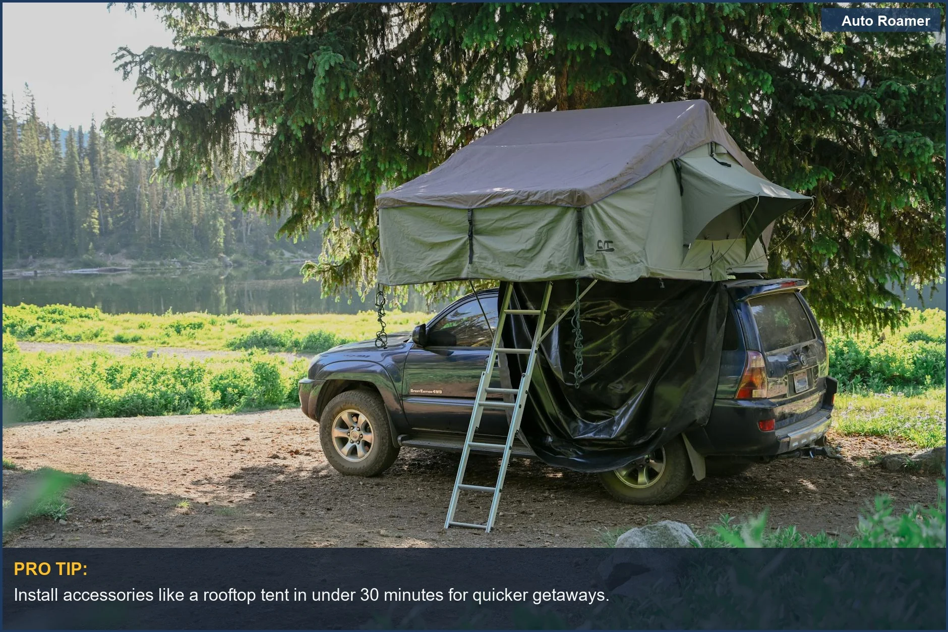 Hyundai Kona parked at serene forest campsite with rooftop tent by the lake.