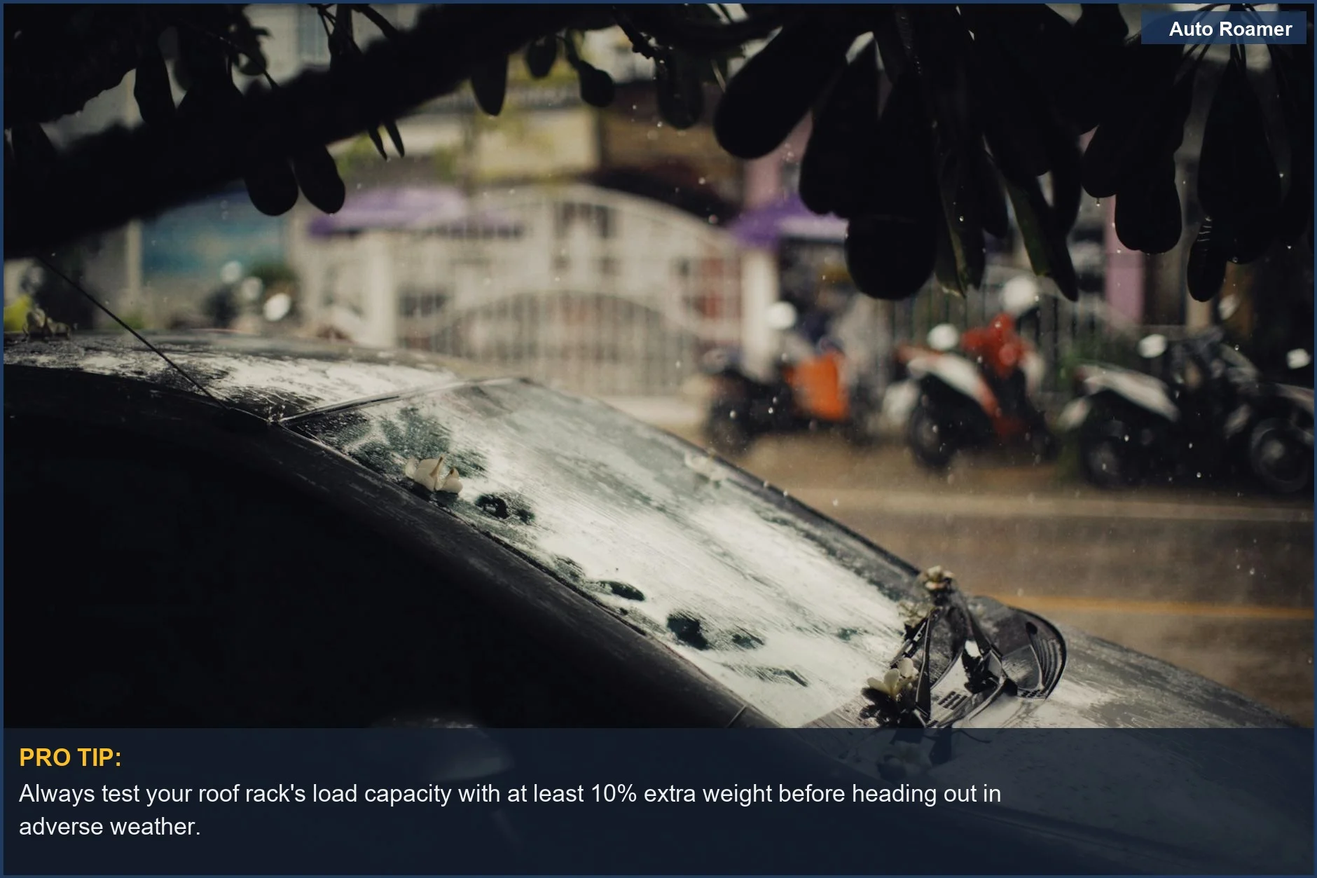 Black Hyundai Santa Cruz parked on a wet city street, covered in raindrops, demonstrating Santa Cruz roof rack weather resistance.