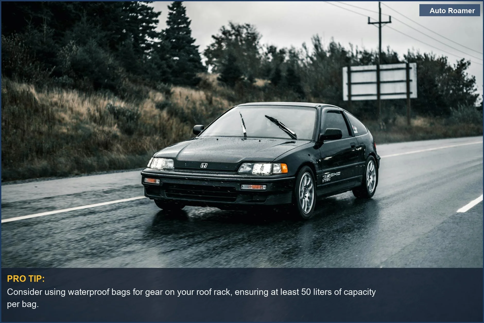 Black Hyundai Santa Cruz driving on a wet road in rain, showcasing transportation in action with weather effects.