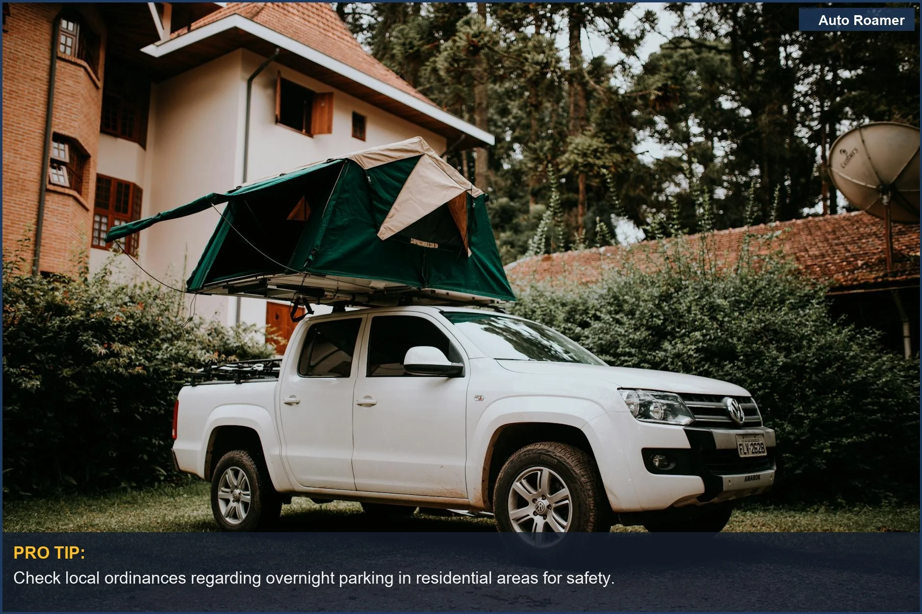 White pickup truck with a rooftop tent parked near a house, representing camping and travel themes with Hyundai Tucson accessories.