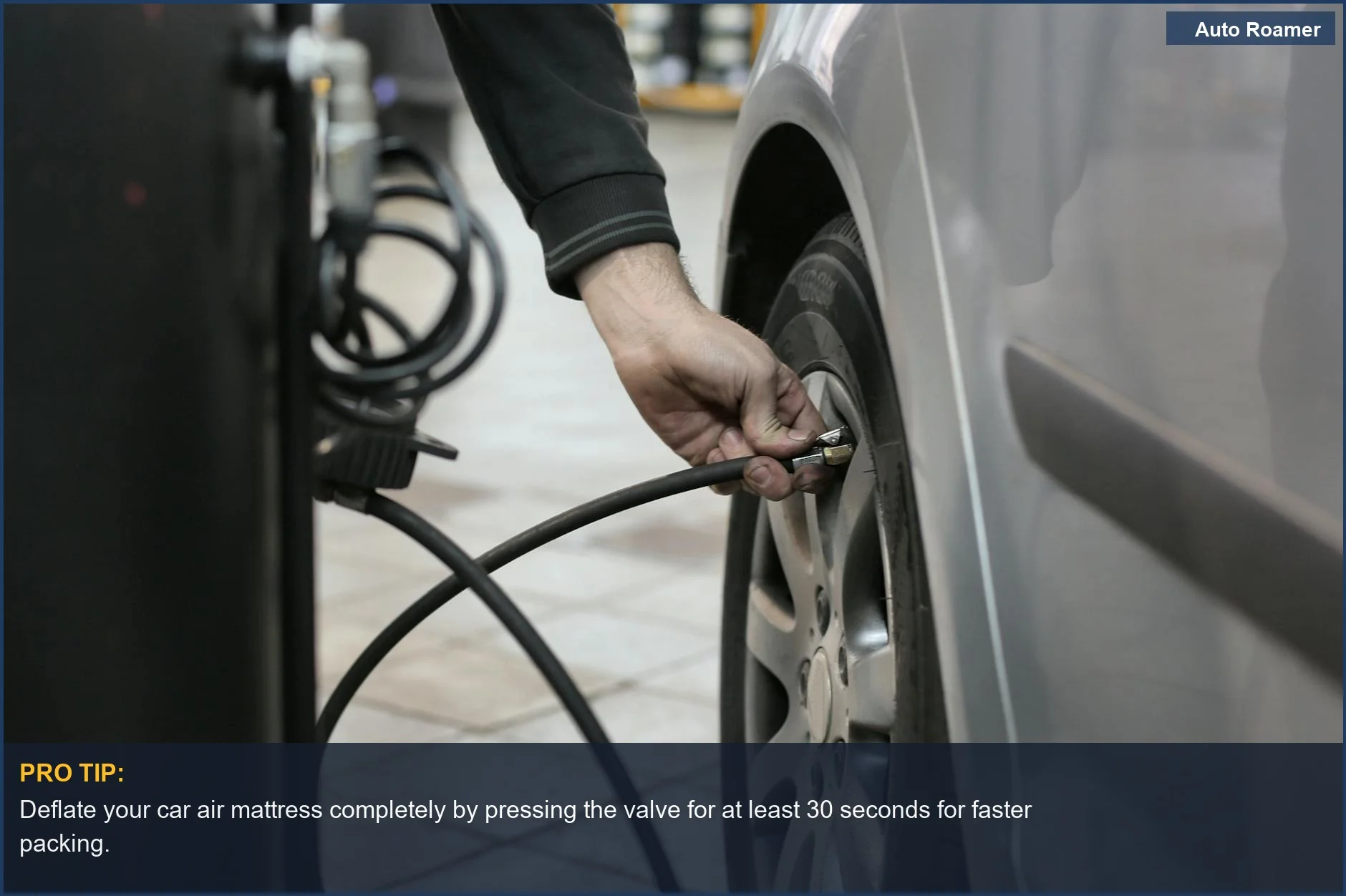 Mechanic checking tire pressure in an auto shop, highlighting the importance of air pressure for car mattresses.