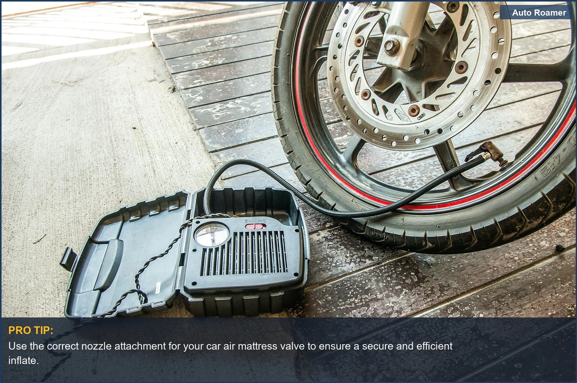 Portable electric pump inflating a motorcycle tire, ideal for car air mattress inflation.
