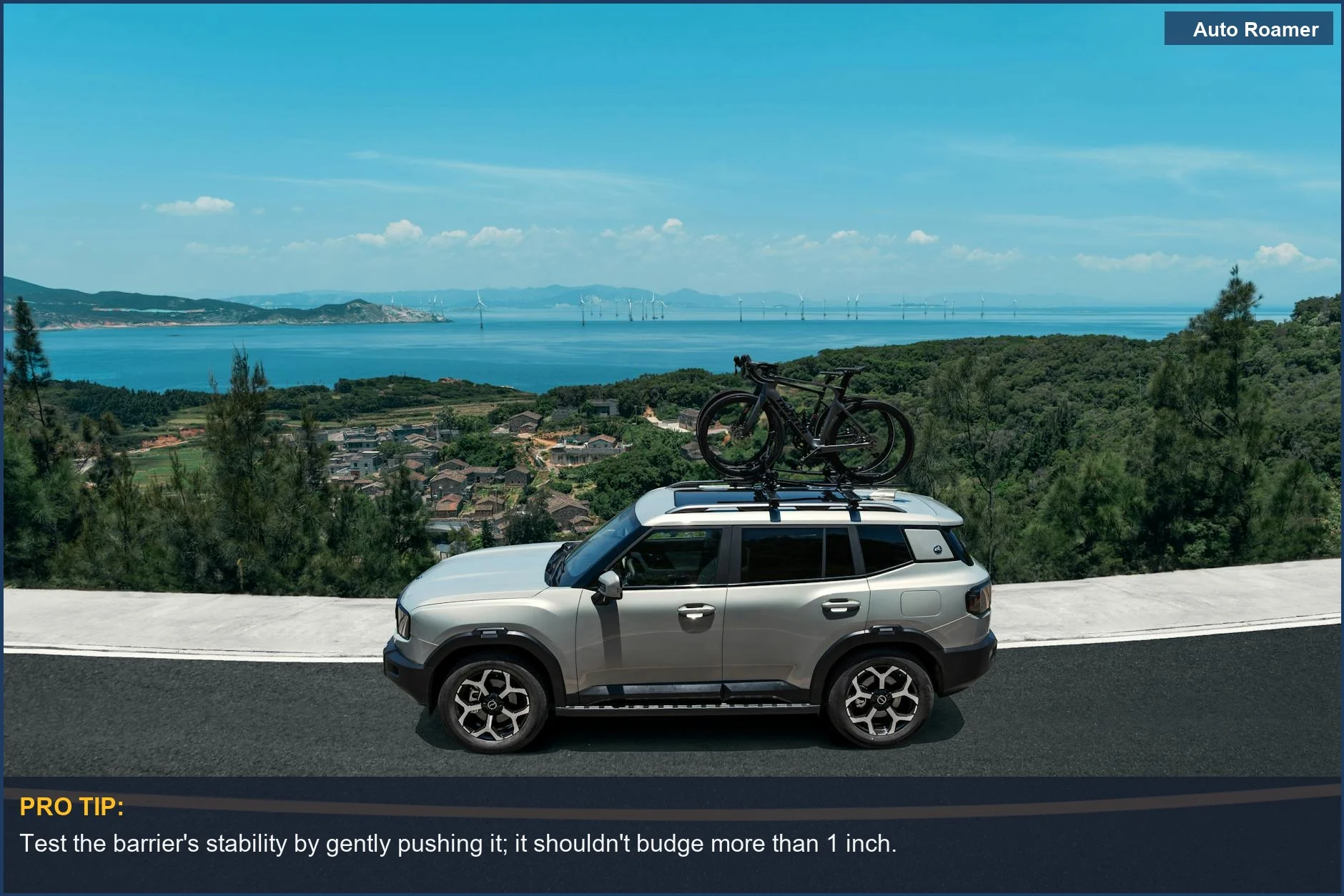 Silver SUV with roof rack driving on a scenic coastal road, ideal for understanding pet barrier setup.