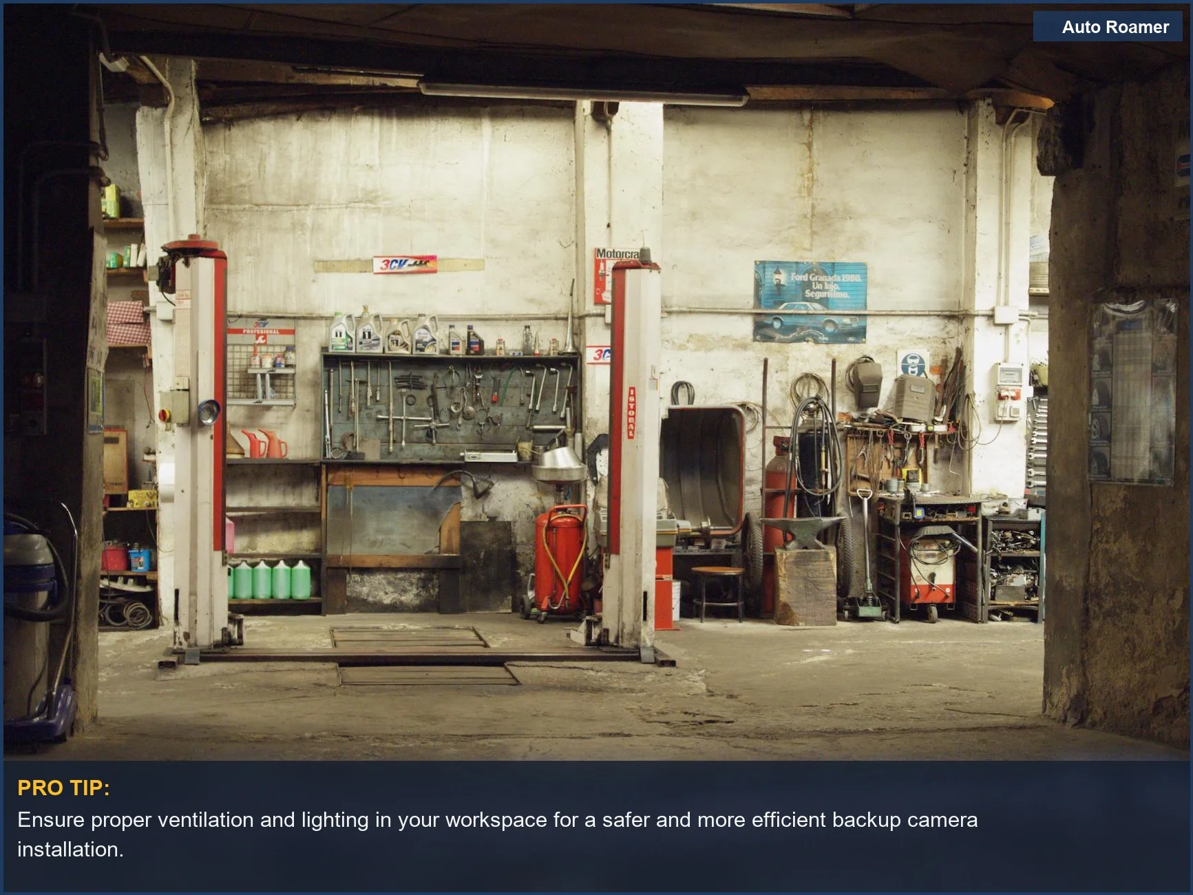 Empty rustic car workshop with machinery and lifts, representing the setting for backup camera installation.