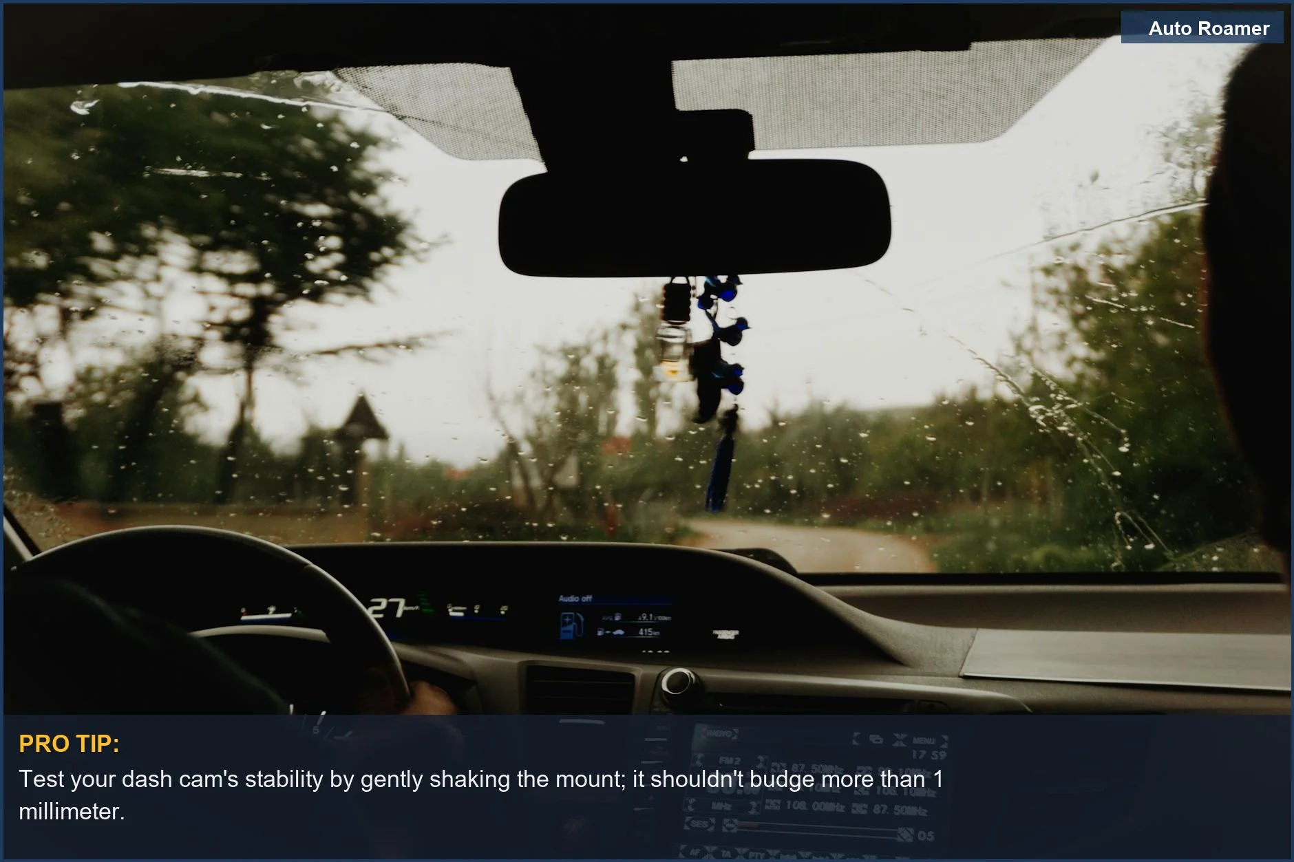 Rainy rural road drive from inside an RV, highlighting the importance of a secure motorhome camera mounting.