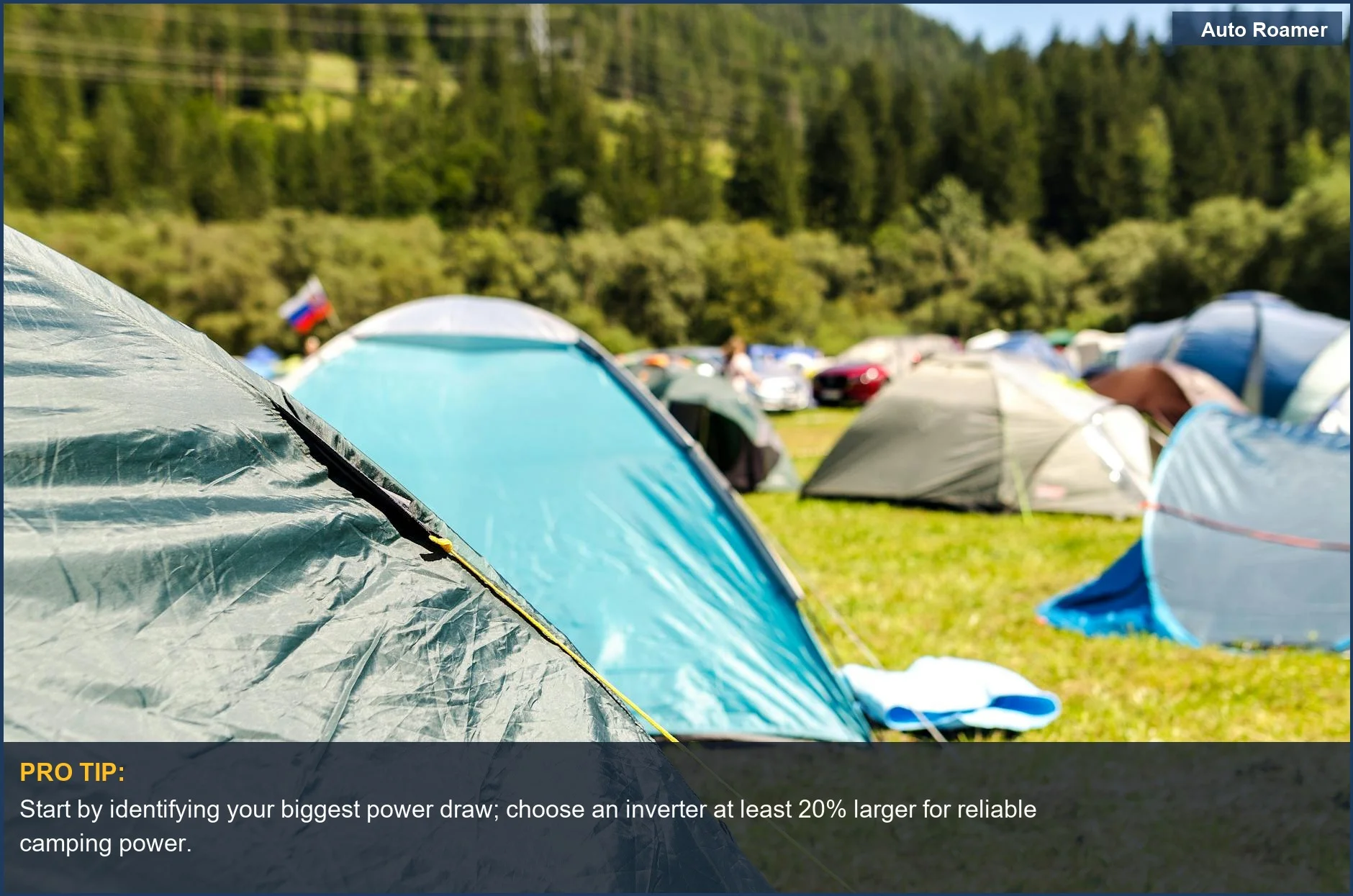 Sunny forest campsite with vibrant tents, perfect for discussing car camping inverter needs.