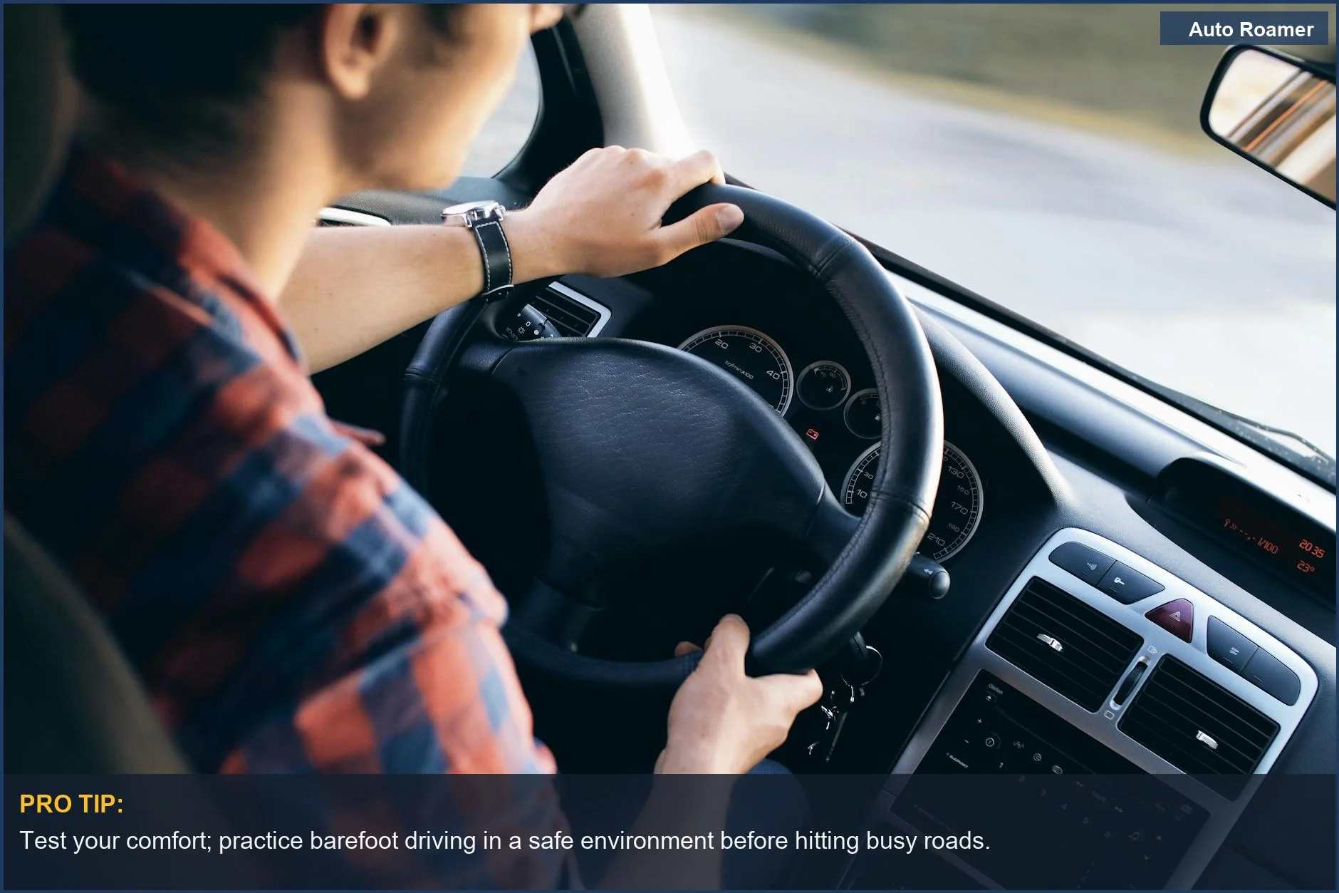 Close-up view inside a modern car, showcasing the steering wheel and dashboard while driving barefoot.