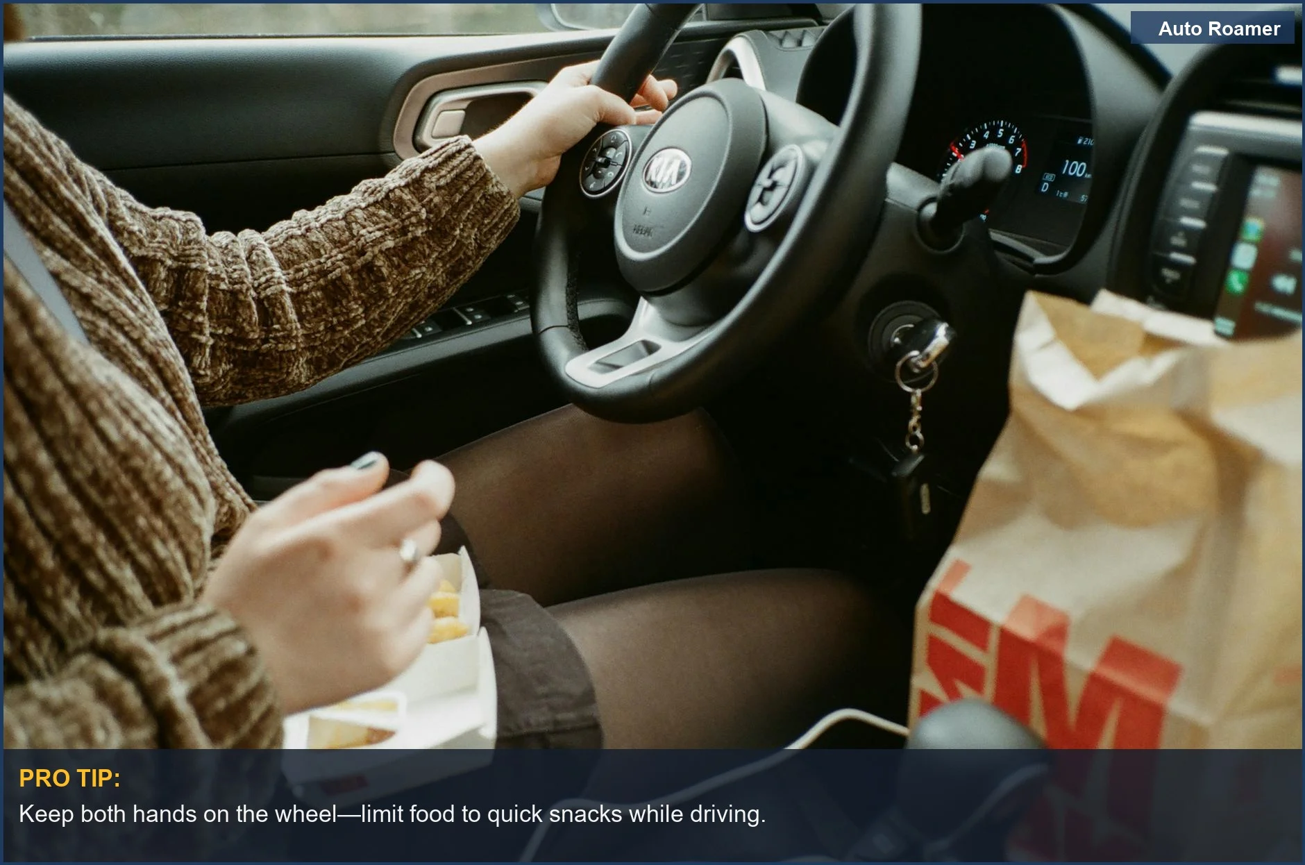 Woman driving a Kia while enjoying fast food, illustrating the debate on eating while driving legality.