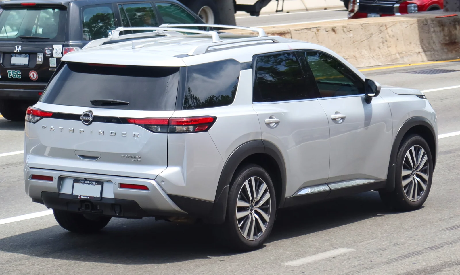 White Nissan Pathfinder, current R53 generation, rear three-quarter view showing the tailgate and PATHFINDER lettering.