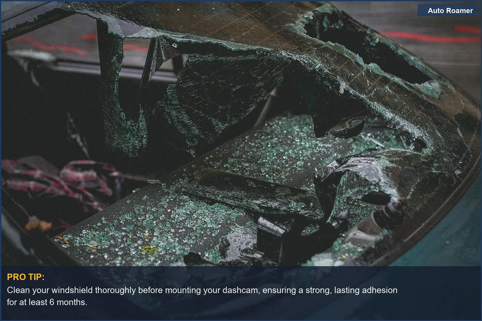 Shattered car windshield with broken glass, showing mounting issues and potential dashcam reliability problems after an accident.