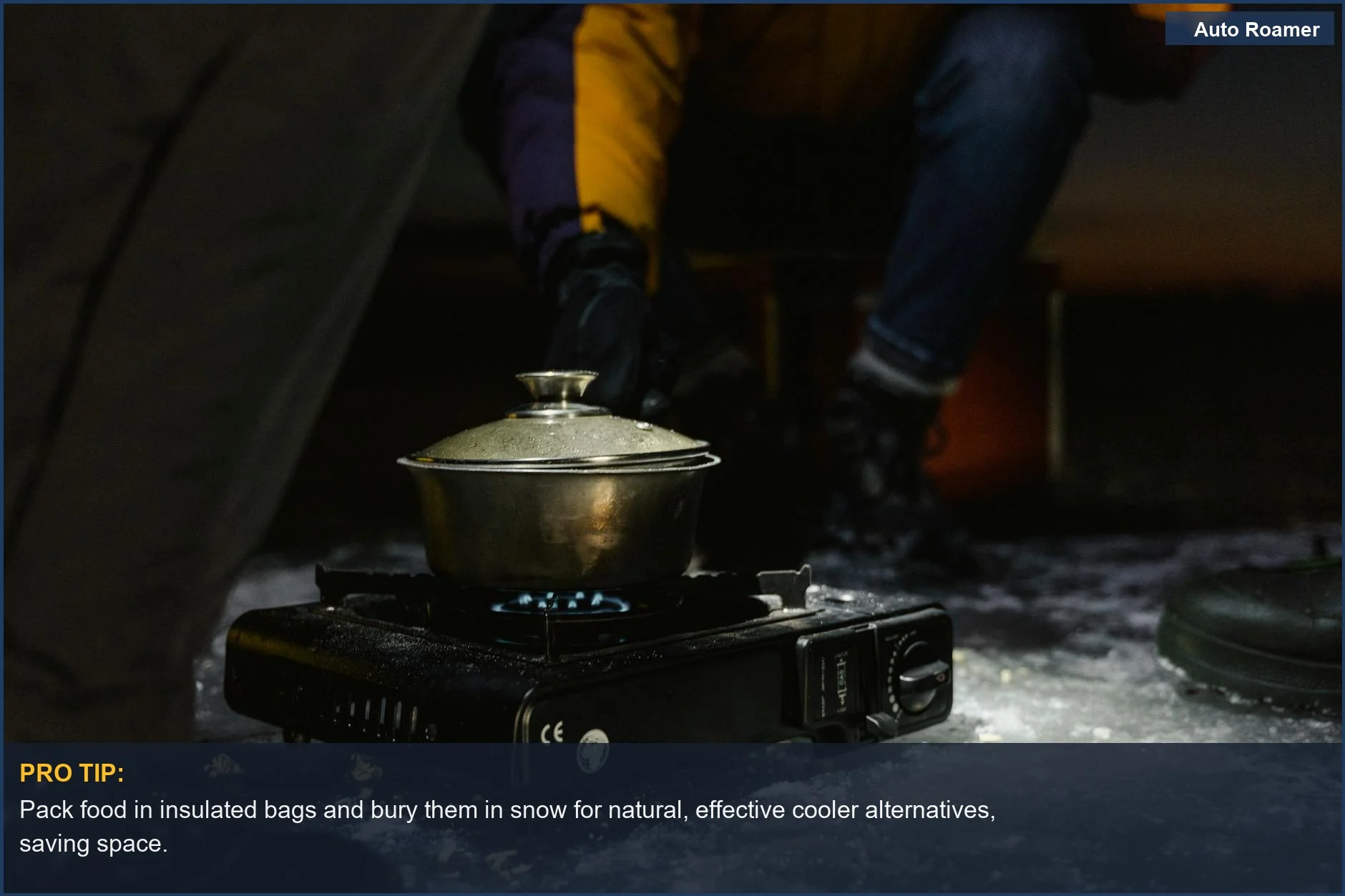 Portable stove cooks food in a pot on snowy ground, illustrating cooler alternatives for winter camping.