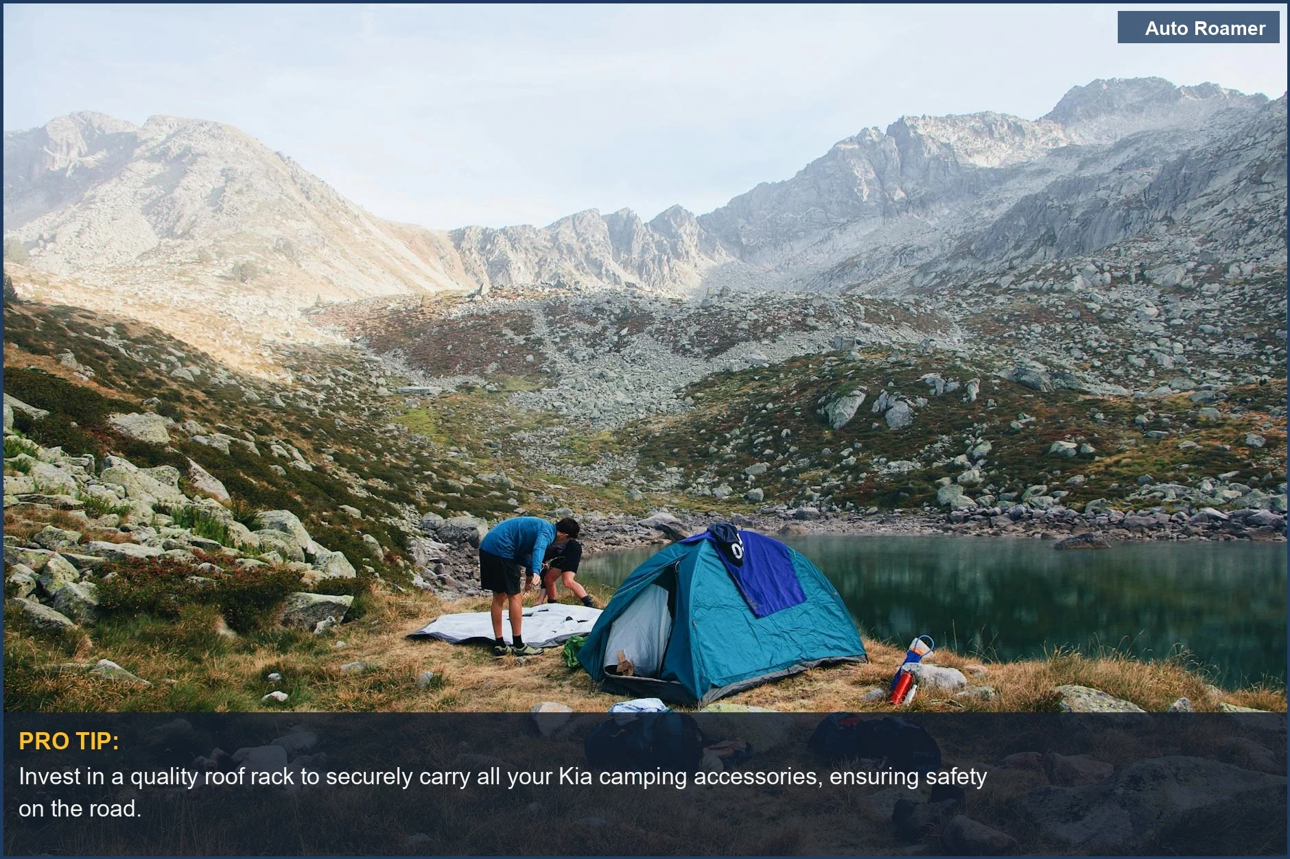 Scenic camping spot by a peaceful lake with Kia camping gear in the foreground.