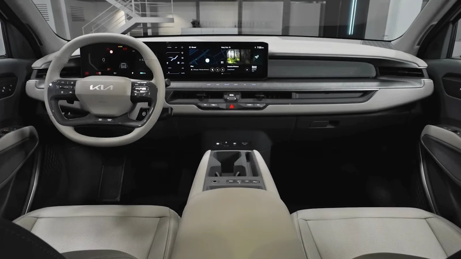 The dashboard and front cabin of a Kia EV9, the electric SUV whose cargo dimensions for sleeping and camp power this guide covers