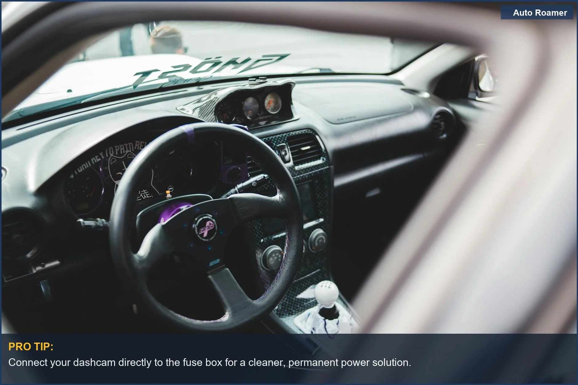 Kia Sportage dashboard interior with steering wheel, ideal for visualizing dashcam power options.