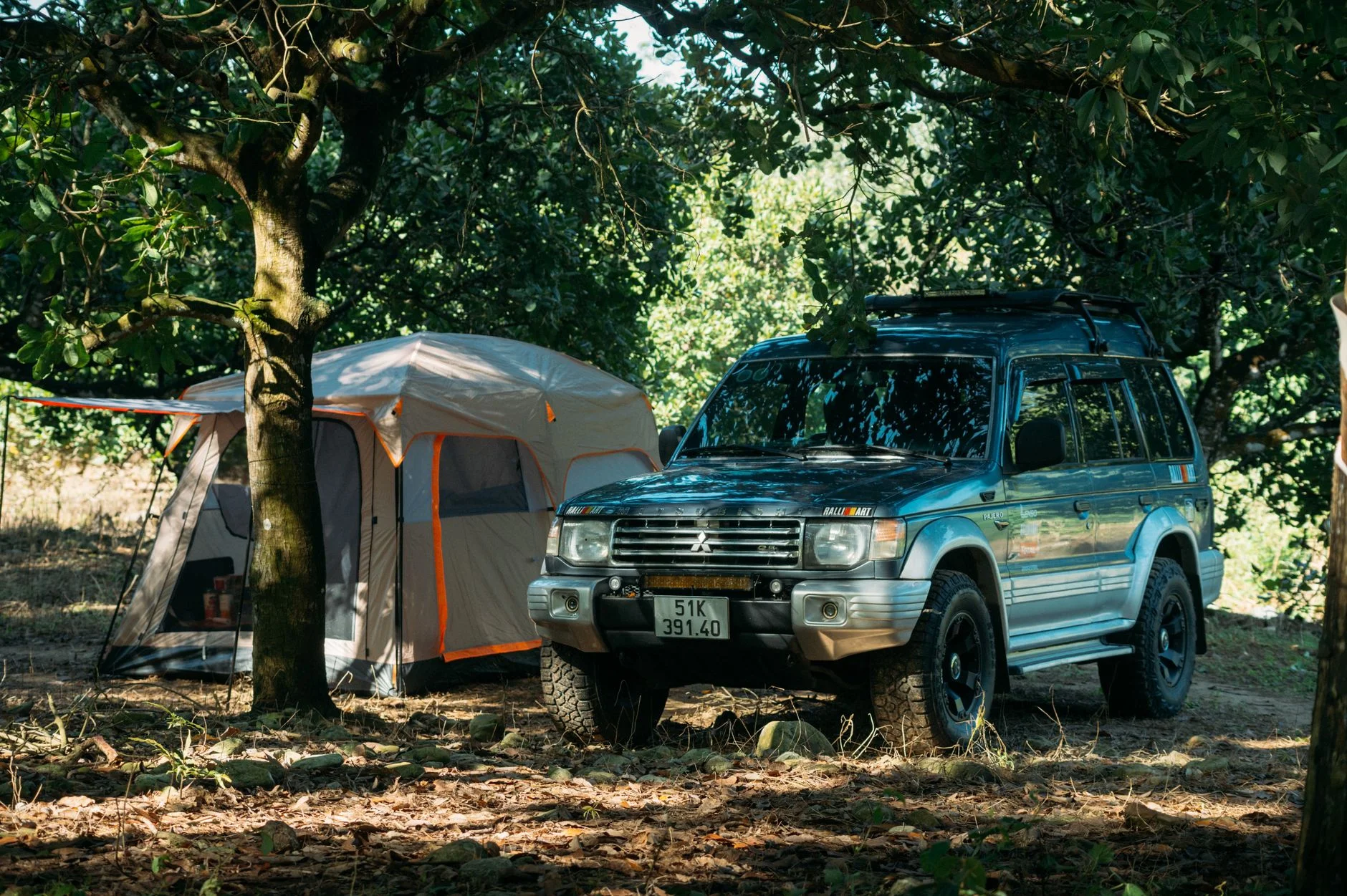 A three-row SUV set up for a road trip and car camping, the use case the Telluride's deep folded cargo hold is built for.