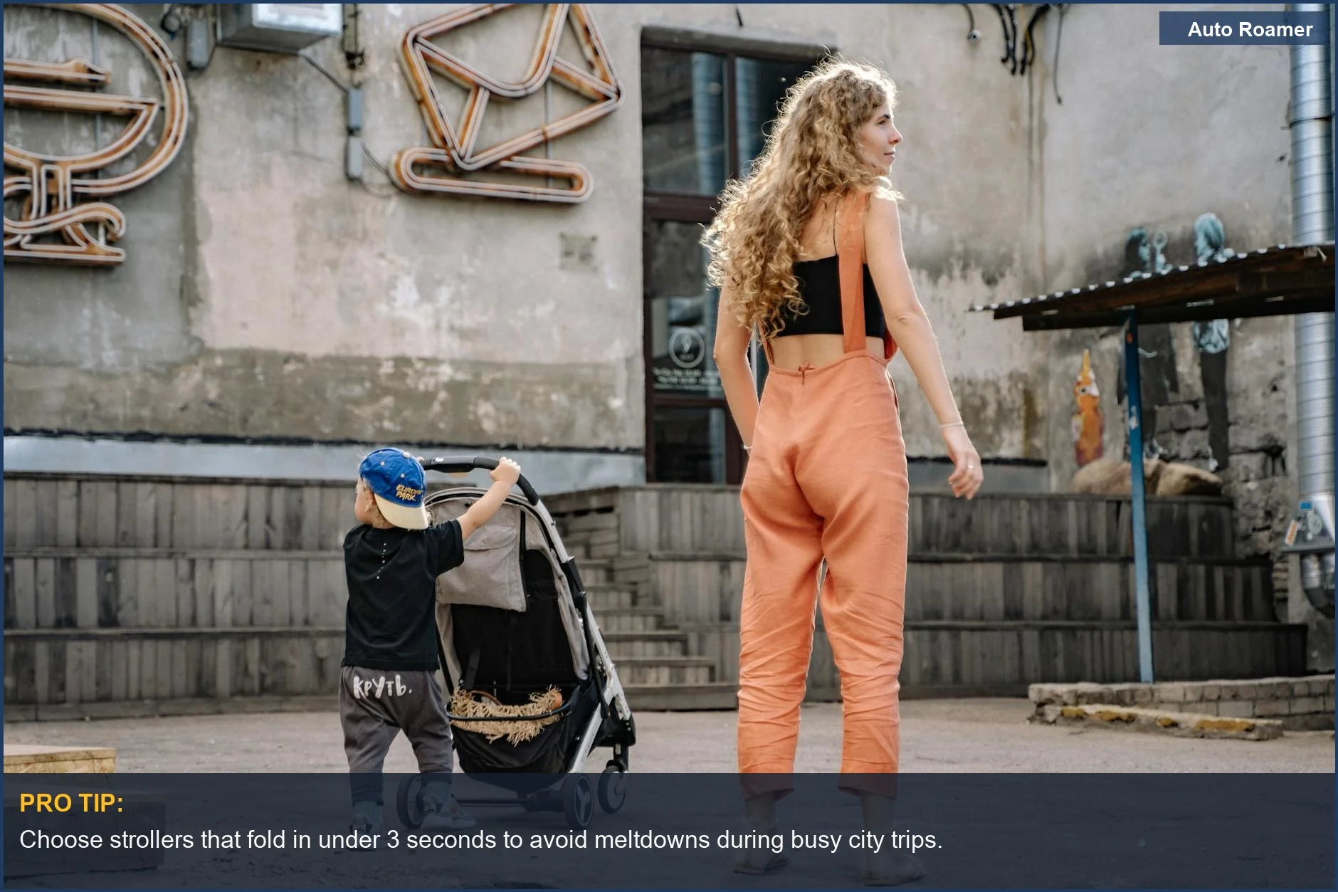 Woman and child with stroller in stylish urban setting, emphasizing kid-friendly features for travel.