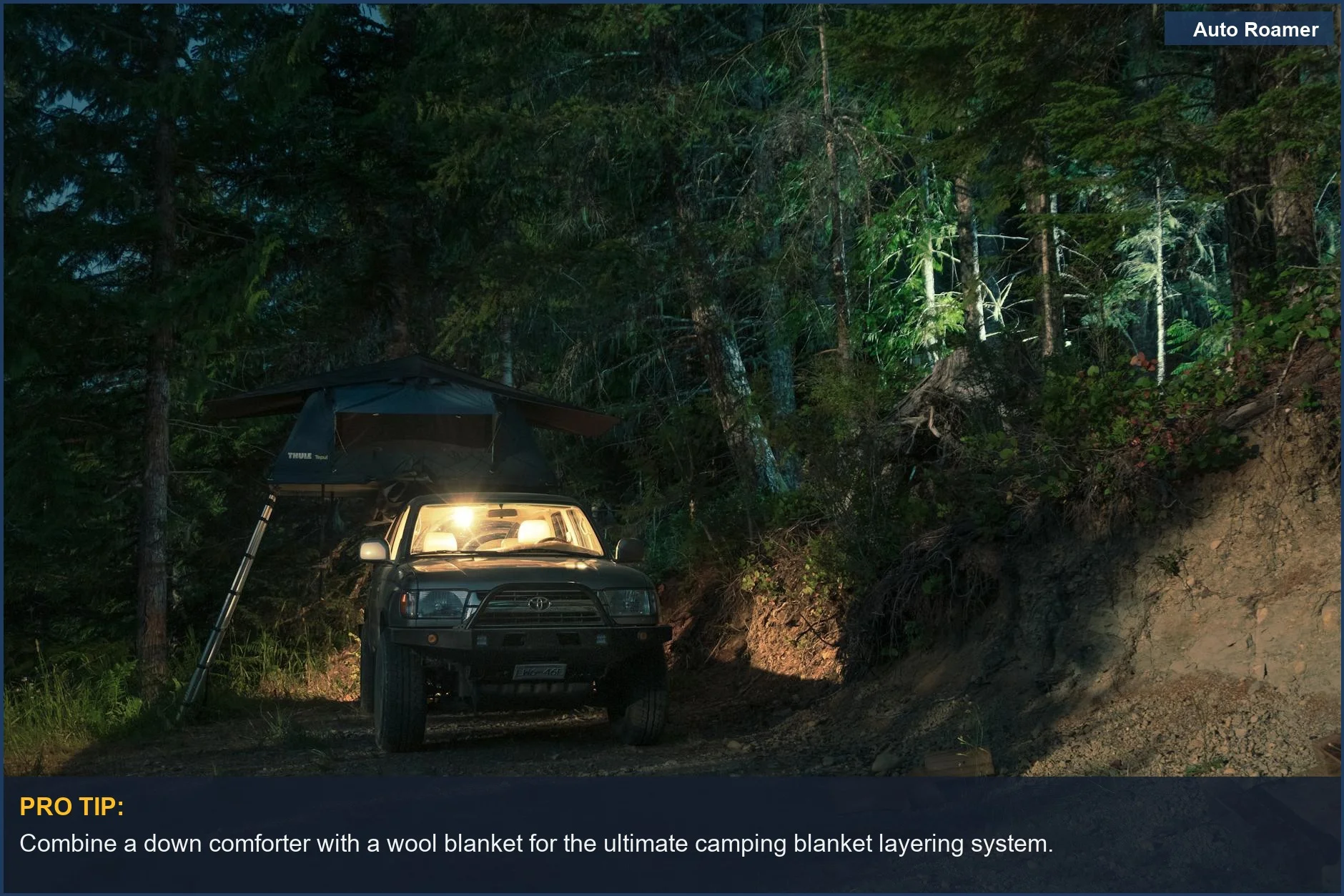 SUV with rooftop tent parked in a dimly lit forest campsite at night, demonstrating car camping blanket layering.