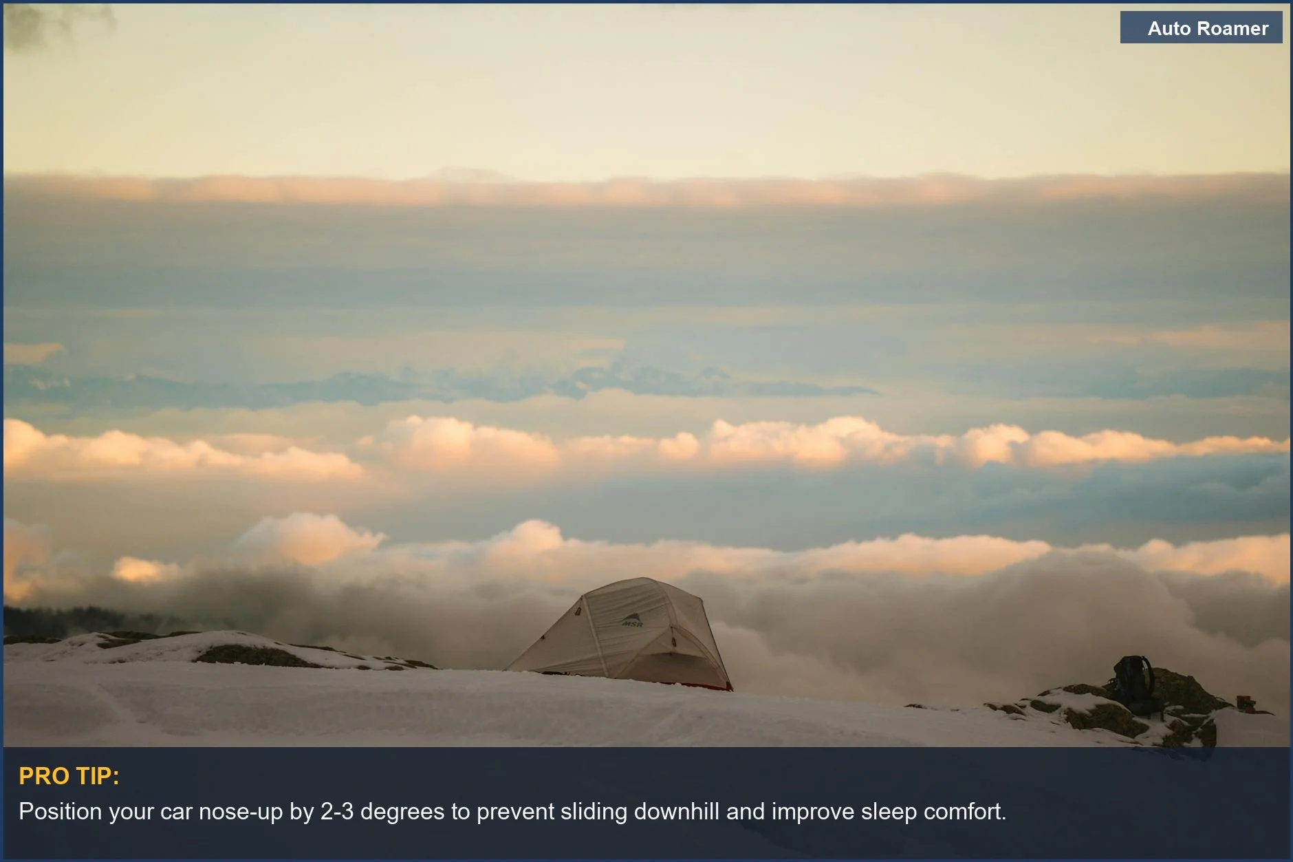 Snowy mountain campsite at sunset, showcasing car camping weather layering possibilities for a comfortable night.