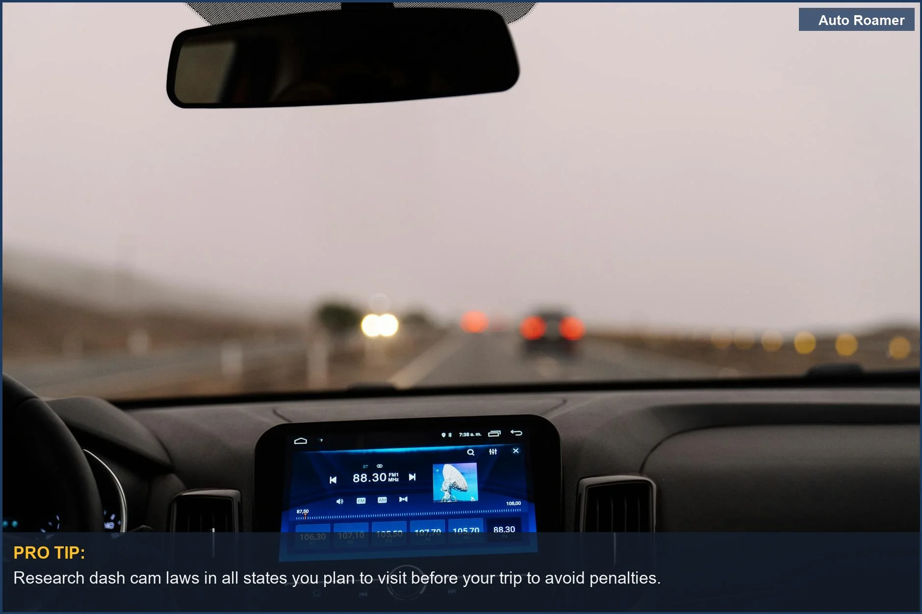Interior car dashboard view on an open road, emphasizing traveling with electronics and dash cam legality.