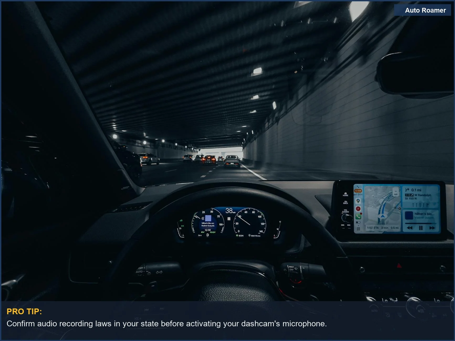 View from car dashboard driving through illuminated city tunnel at night, relevant to driving recording.
