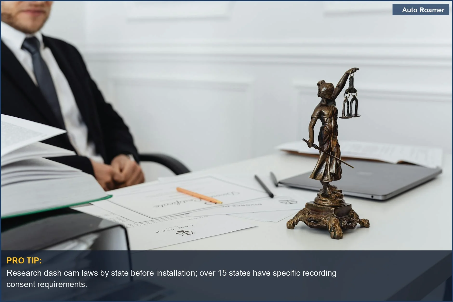 Law office with Lady Justice statue and laptop, illustrating legal considerations for dashcam laws.