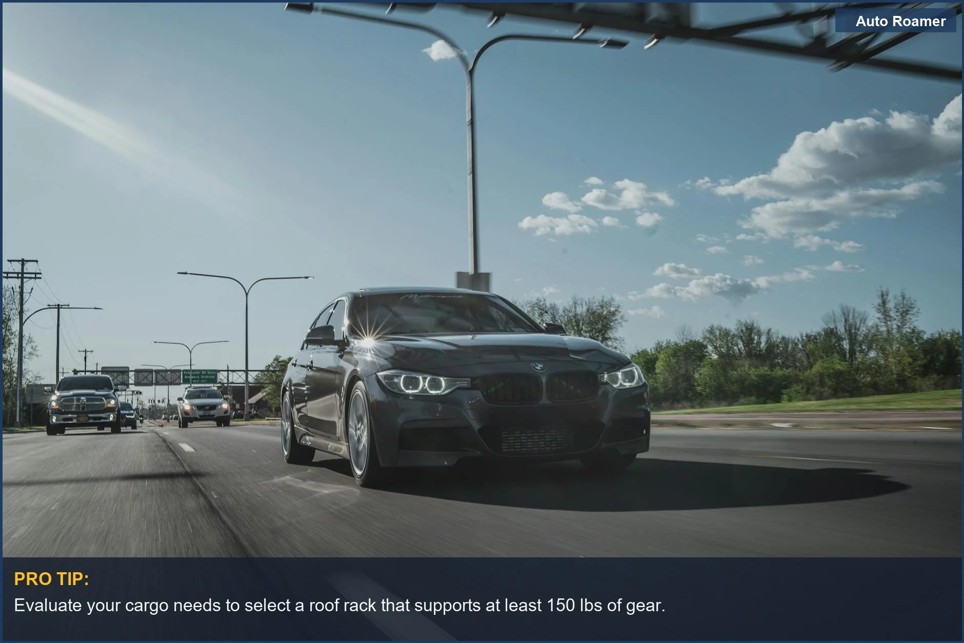Black Lexus GX 550 on sunny highway, demonstrating speed and roof rack versatility.