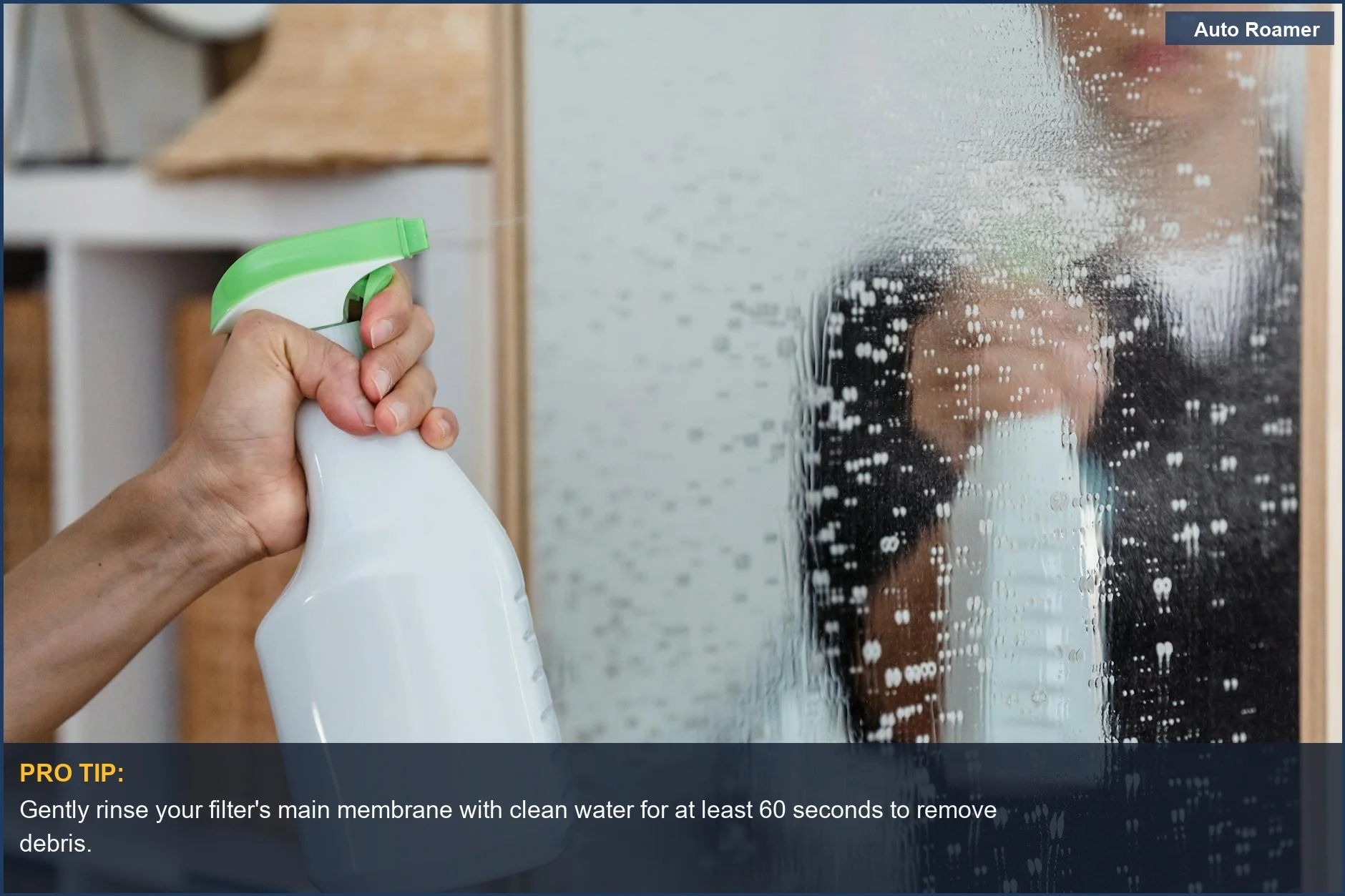 Close-up of hand cleaning a water filter component with a spray bottle, ensuring proper portable water filter care.