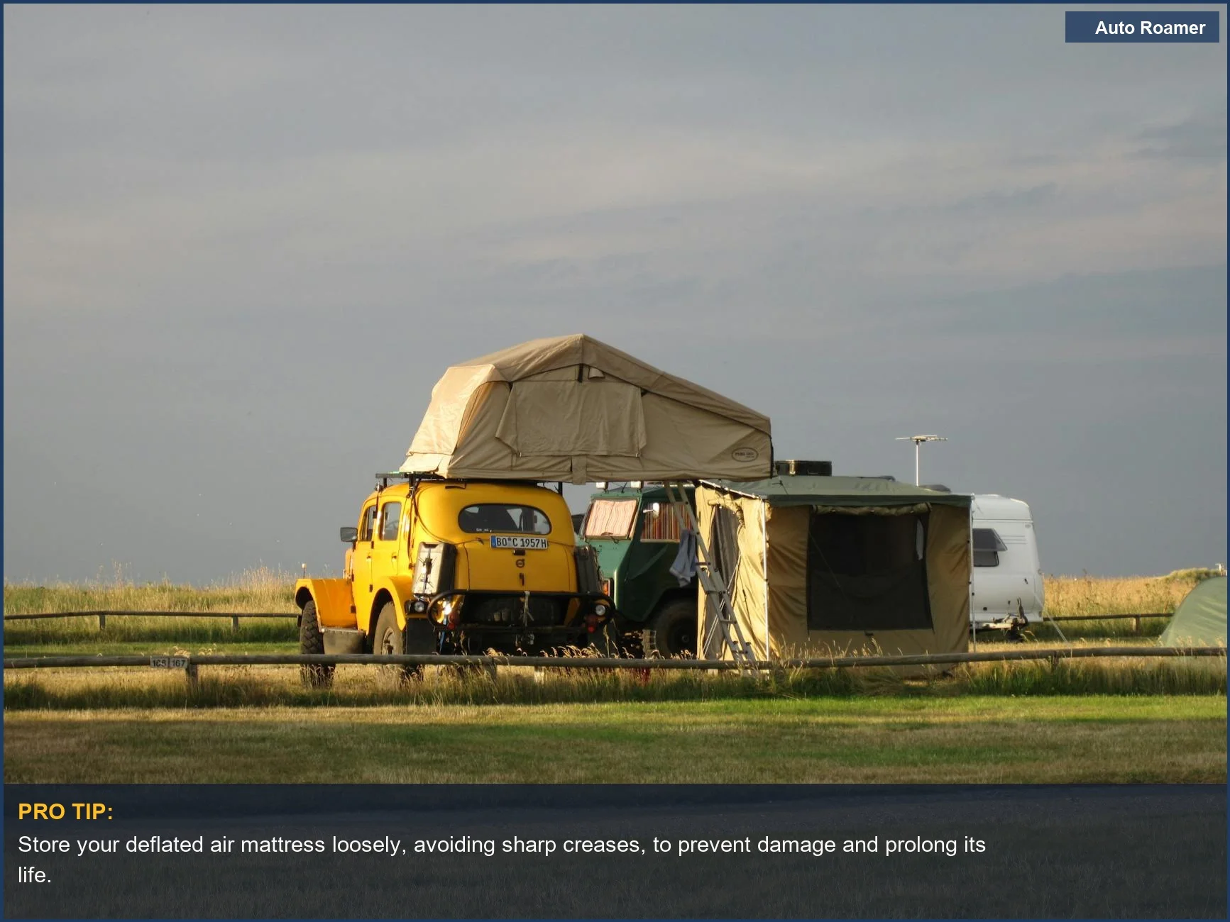 Classic car with rooftop tent, showcasing proper inflatable car bed maintenance for road trips.