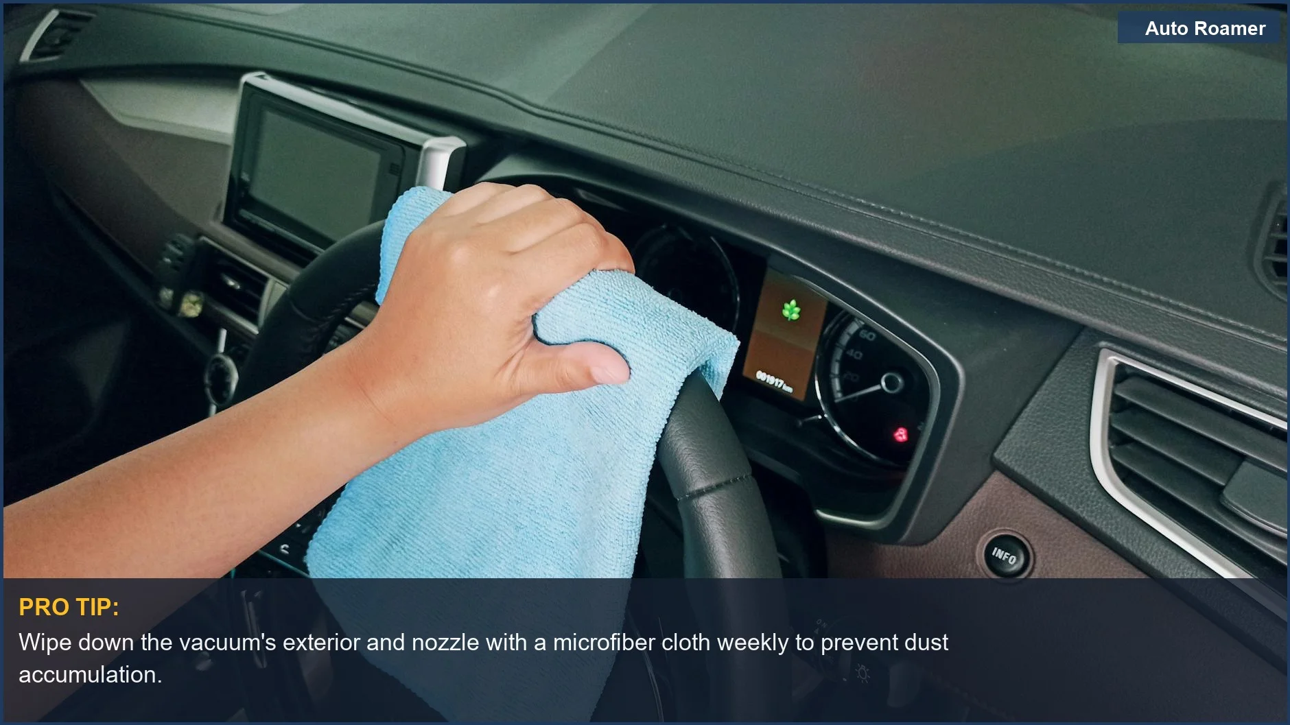 Close-up of hand wiping car steering wheel with microfiber cloth, part of car maintenance.