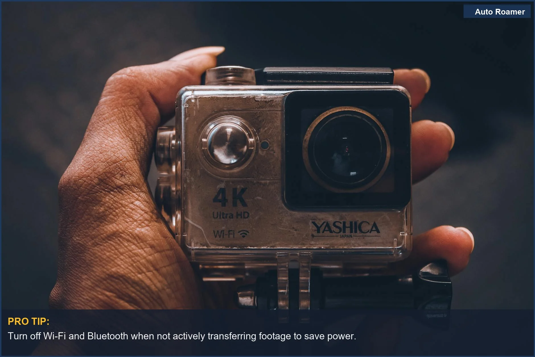 Hand holding a compact 4K action camera, demonstrating control for maximizing battery life.