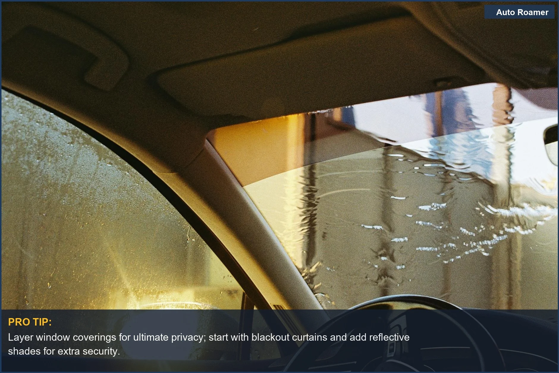 Inside car view of a wet windshield, suggesting privacy for vehicle sleeping security on a rainy night.