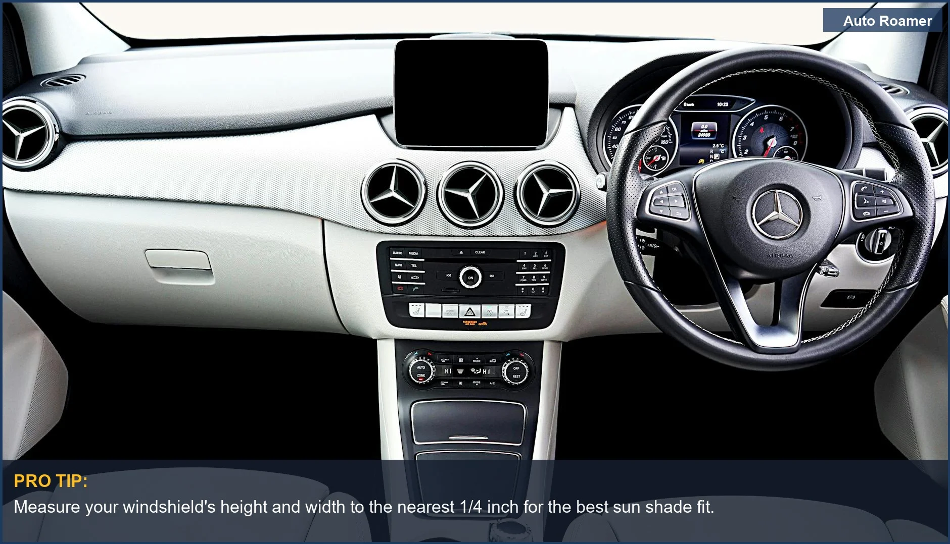 Modern Mercedes dashboard and steering wheel, highlighting the need for precise windshield sun shade sizing.