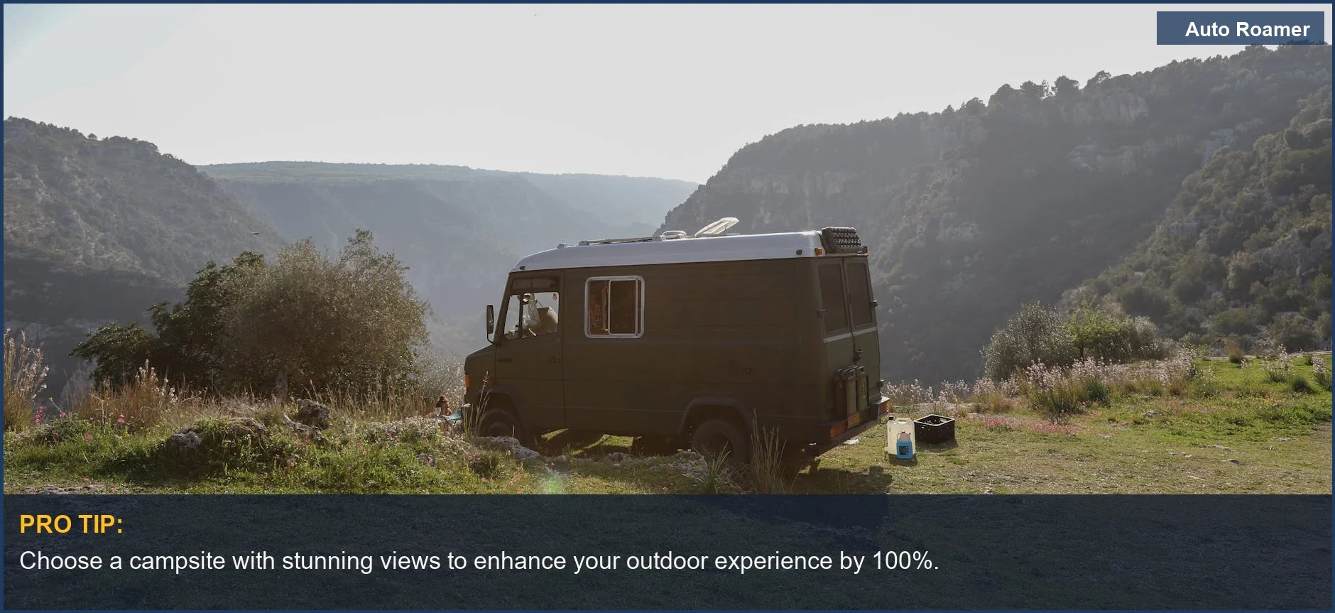 Black Mercedes-Benz camping van parked in a scenic valley, perfect for nature lovers.
