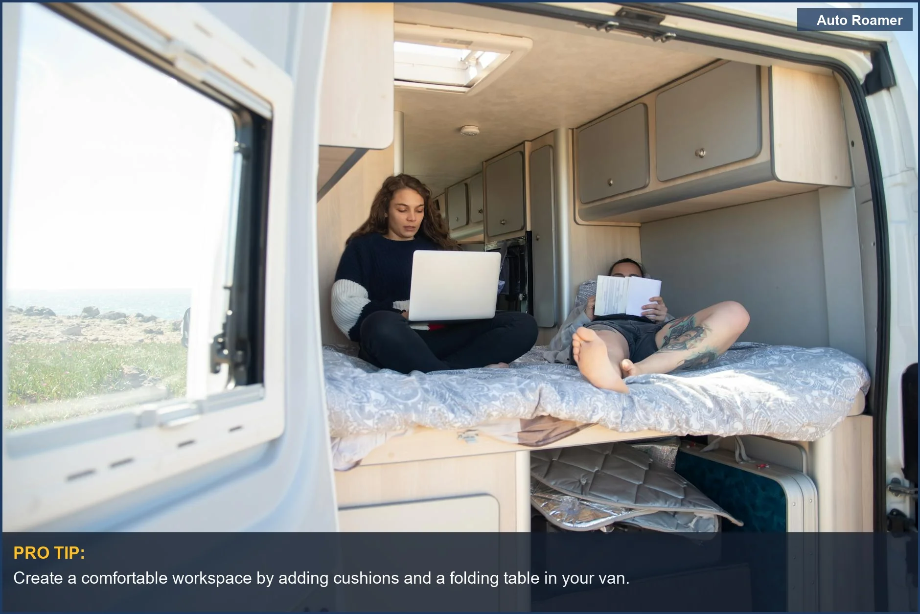 Couple working and relaxing inside a Mercedes-Benz camping van with a laptop and a book.