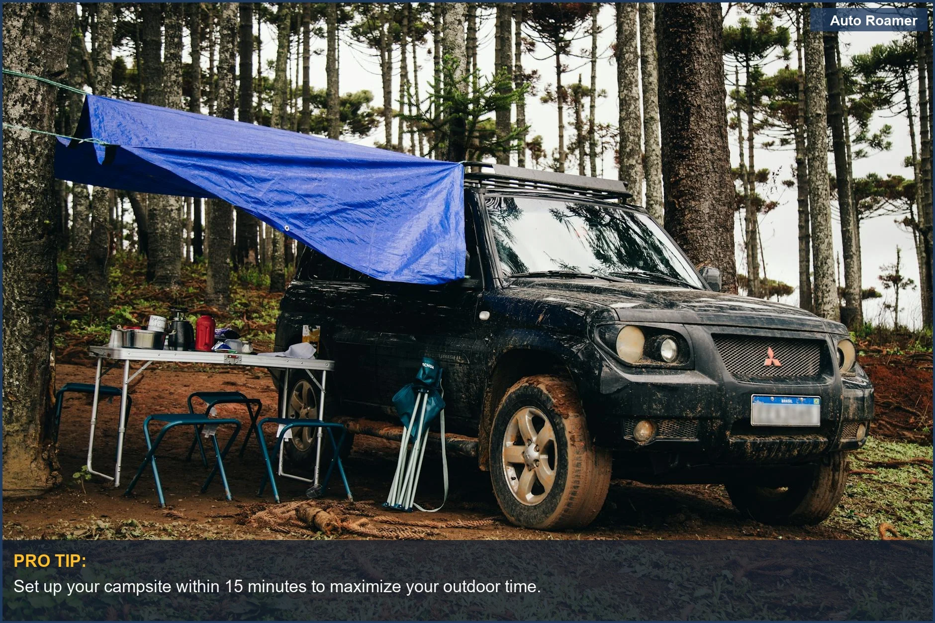 SUV parked in a forest with camping gear and chairs set up.