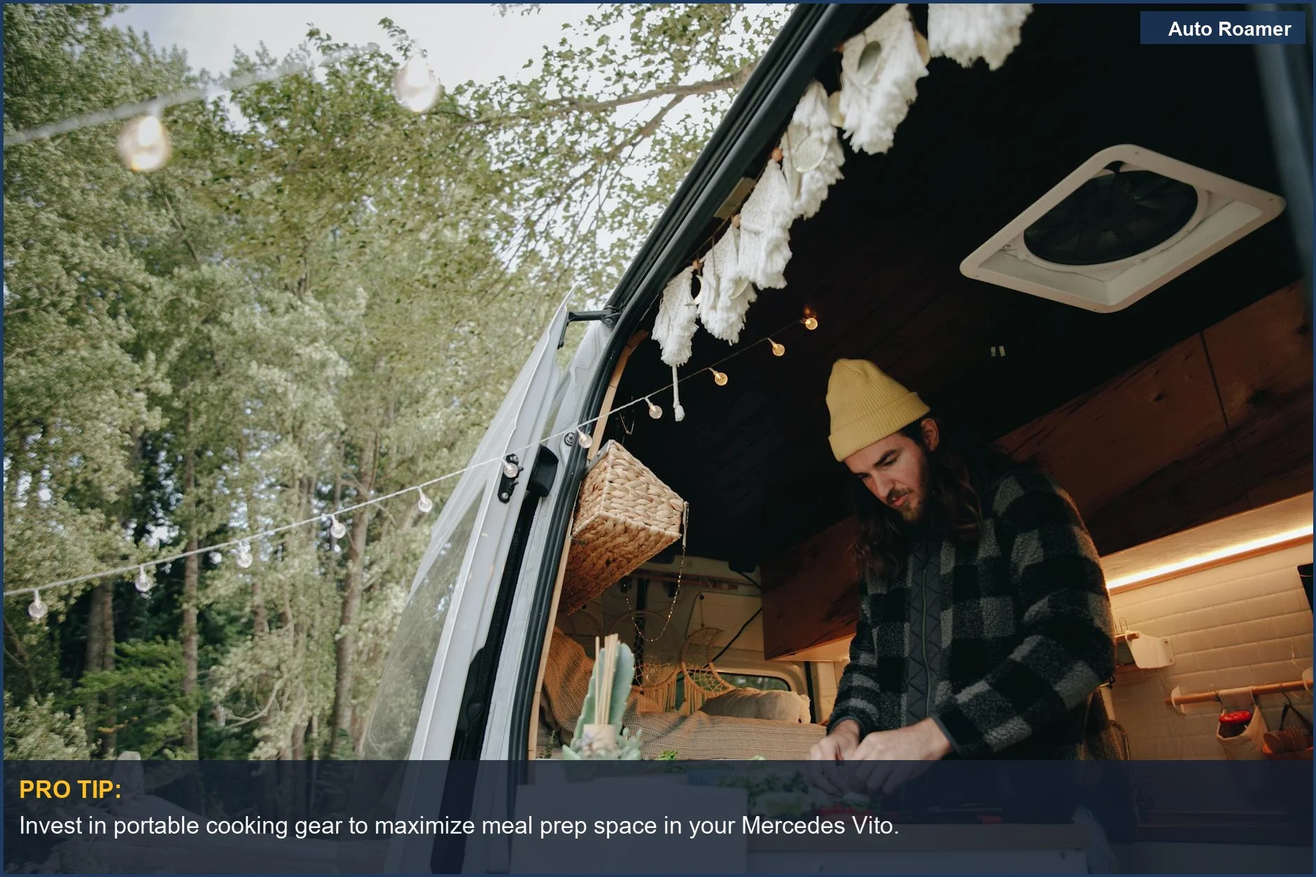 A man cooking in a campervan kitchen surrounded by a scenic forest, representing van life.