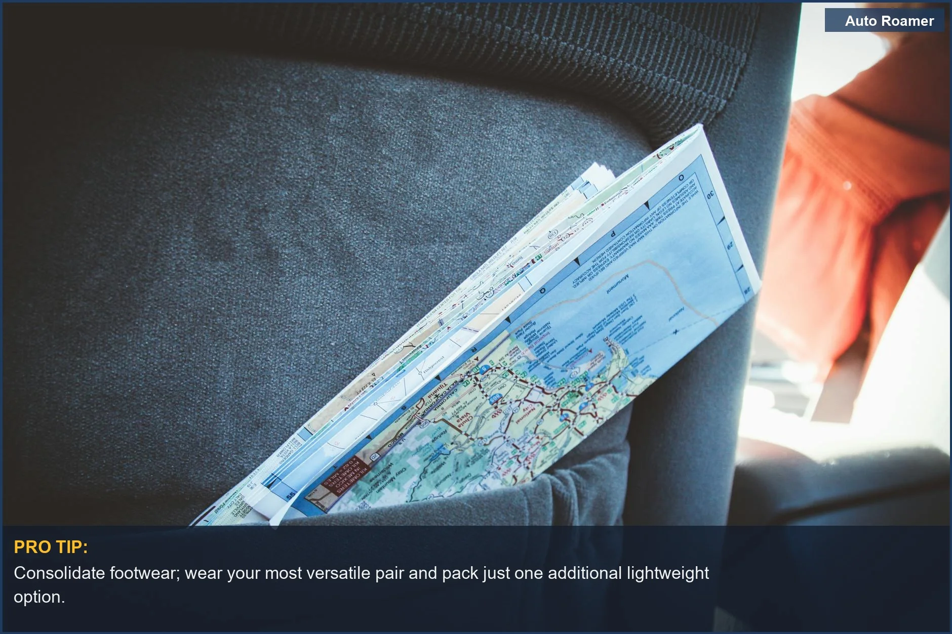 Folded map in a car seat pocket, essential for planning minimalist road trips and navigation.
