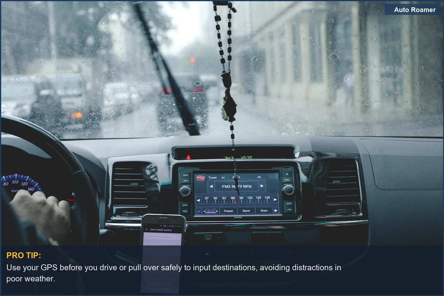 Driver navigating a rainy cityscape using phone and dashboard, emphasizing the increased risk of car accidents near home.