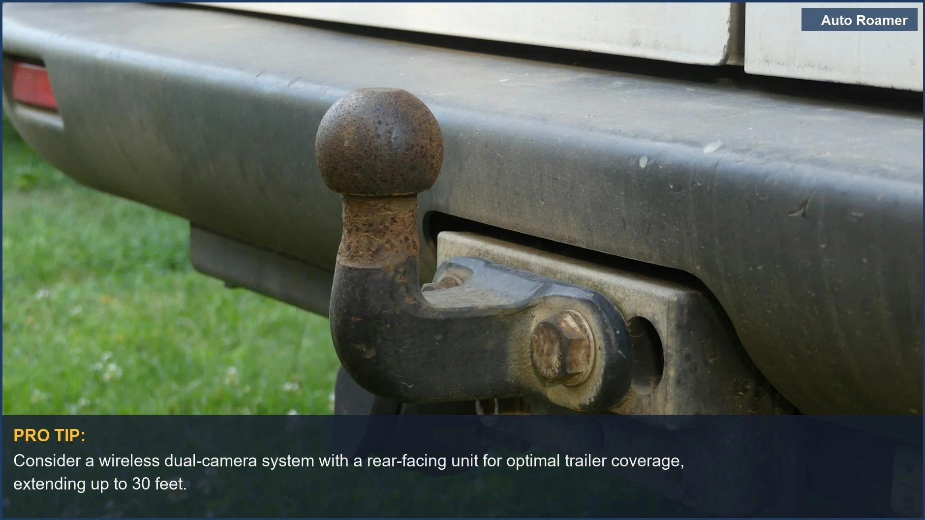 Rusty tow hitch on a vehicle's rear bumper highlights the need for trailer camera placement when towing.