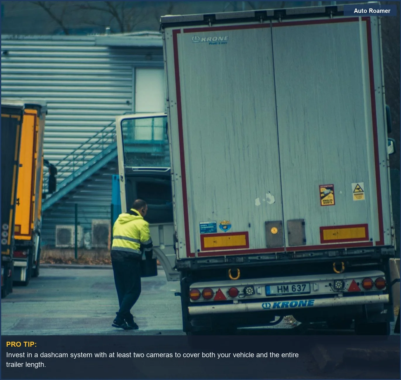 Truck driver unloading cargo underscores the importance of trailer coverage in dashcam installation for towing.