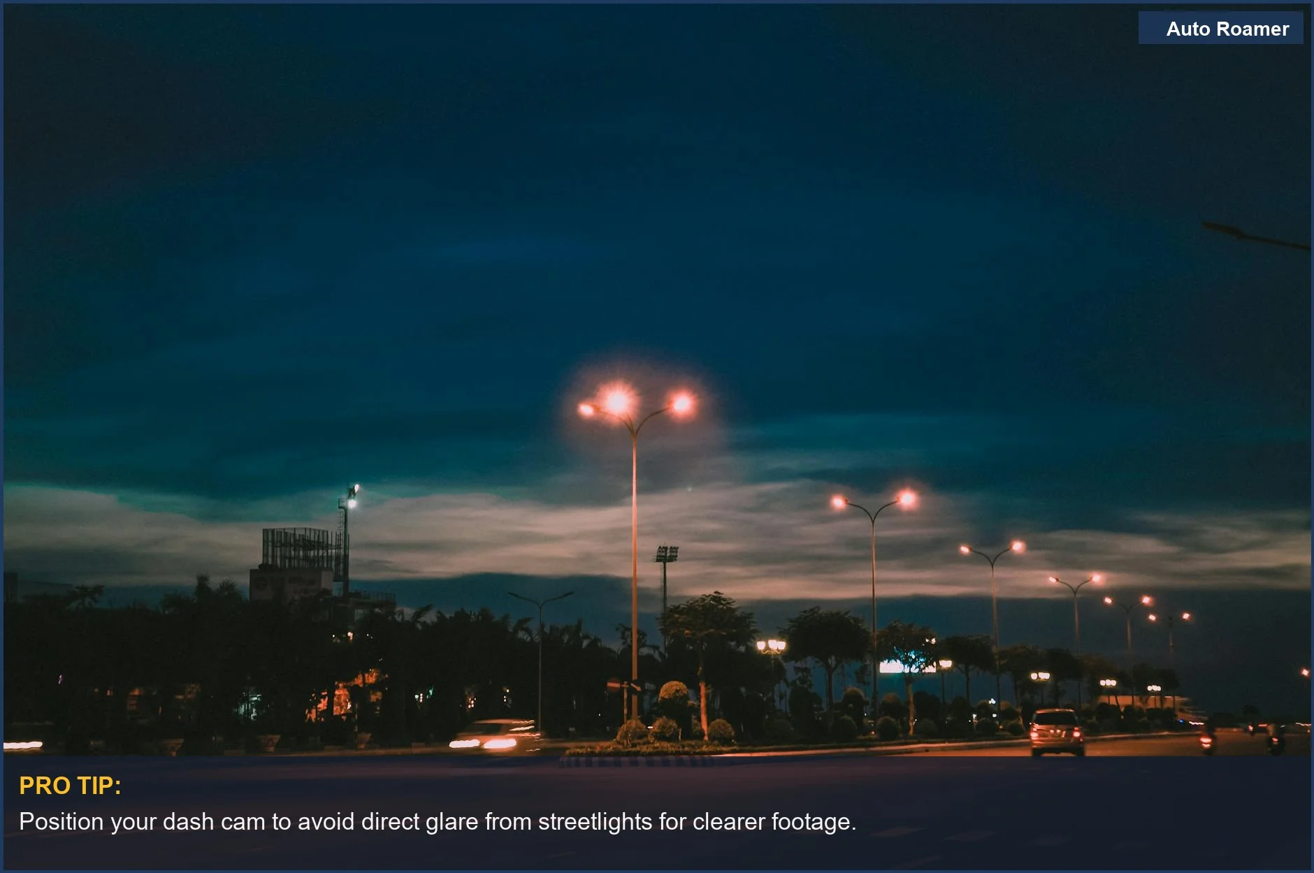Urban road at night with glowing streetlights, essential for dash cam for low light conditions.