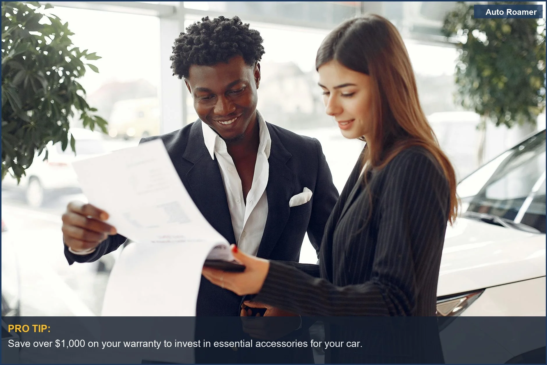 Professional consultant and smiling businessman reviewing contract details for an extended car warranty.