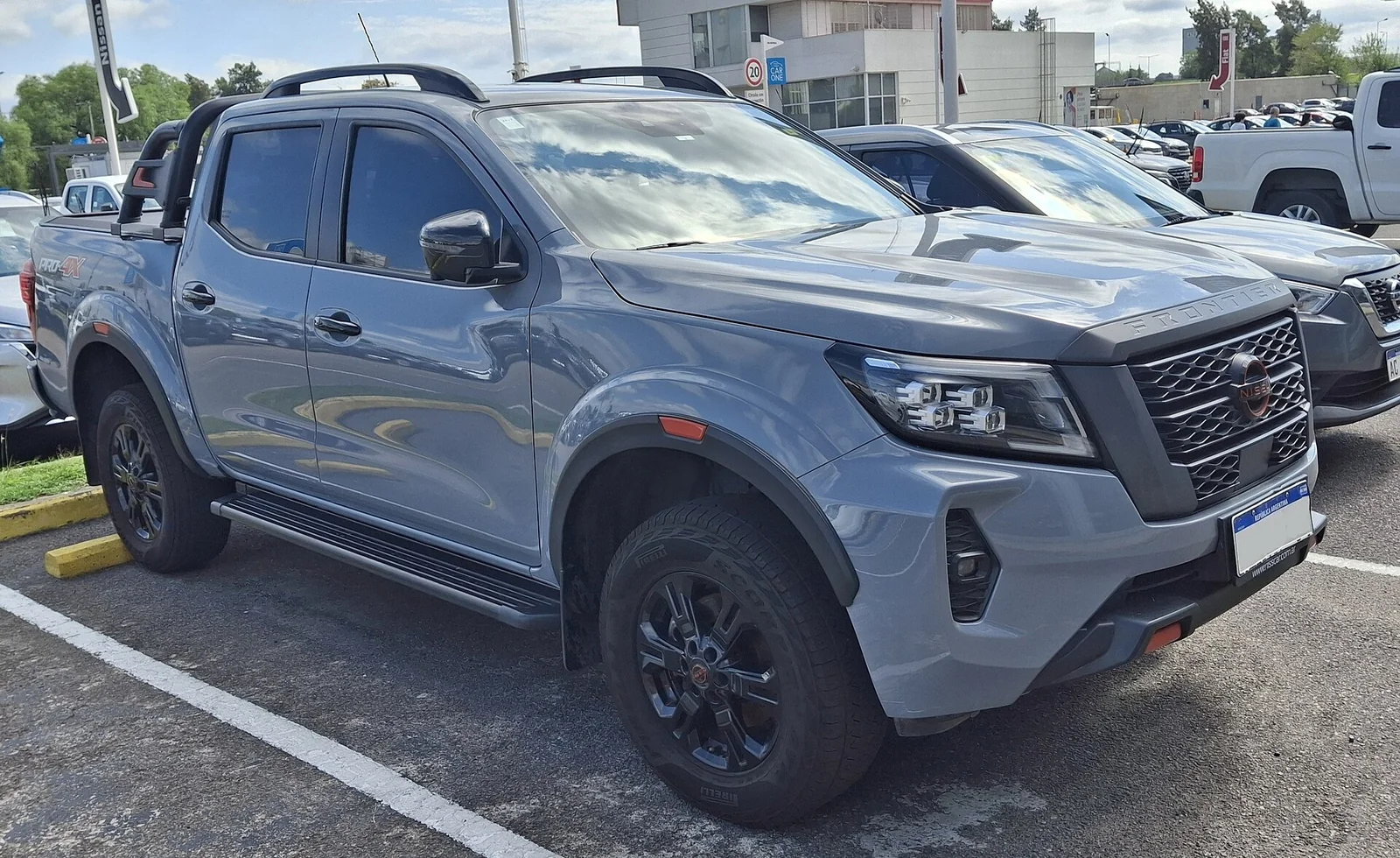 Grey Nissan Frontier Pro-4X crew-cab pickup truck