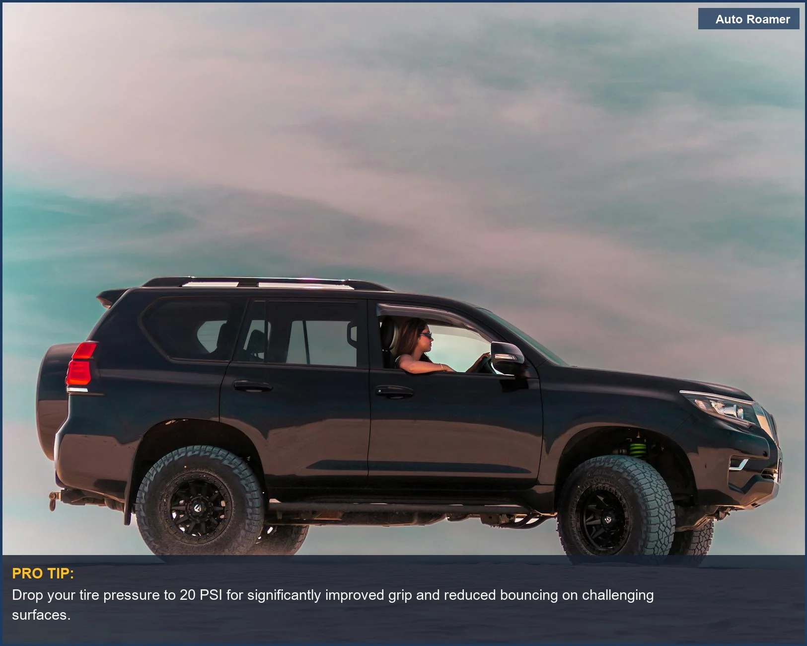 4x4 vehicle navigating sandy dunes in Western Australia, showcasing the benefits of lower overlanding tire pressure for grip.