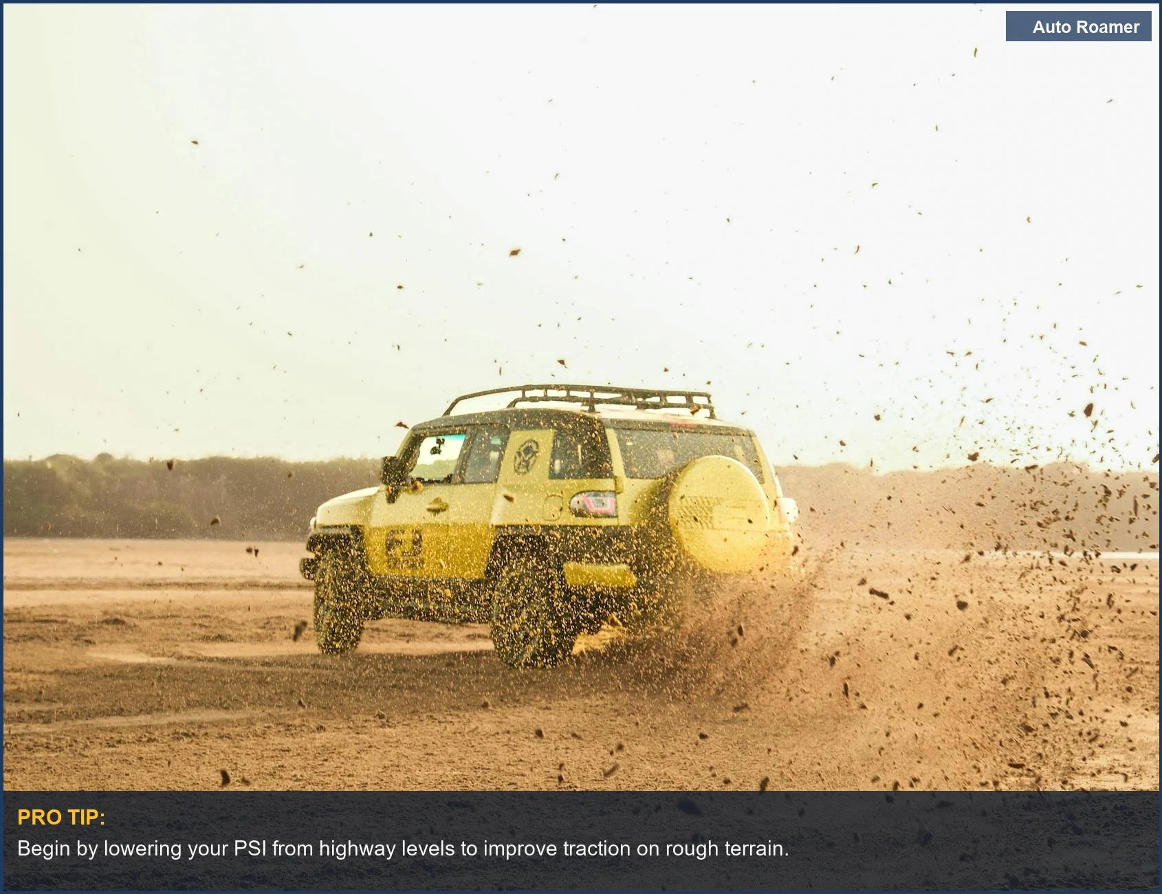 Yellow SUV kicking up dust on a desert off-road trail, demonstrating the need for proper trail inflation.