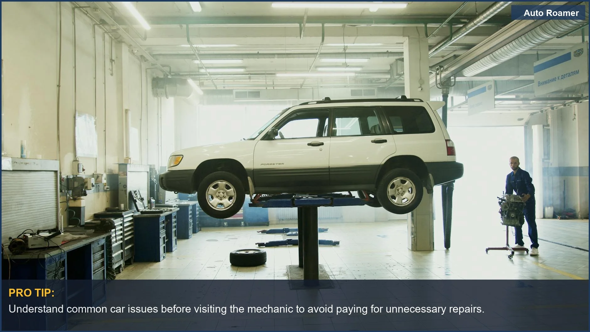 Mechanic inspecting a car on a lift, highlighting the knowledge gap in unnecessary car repairs.