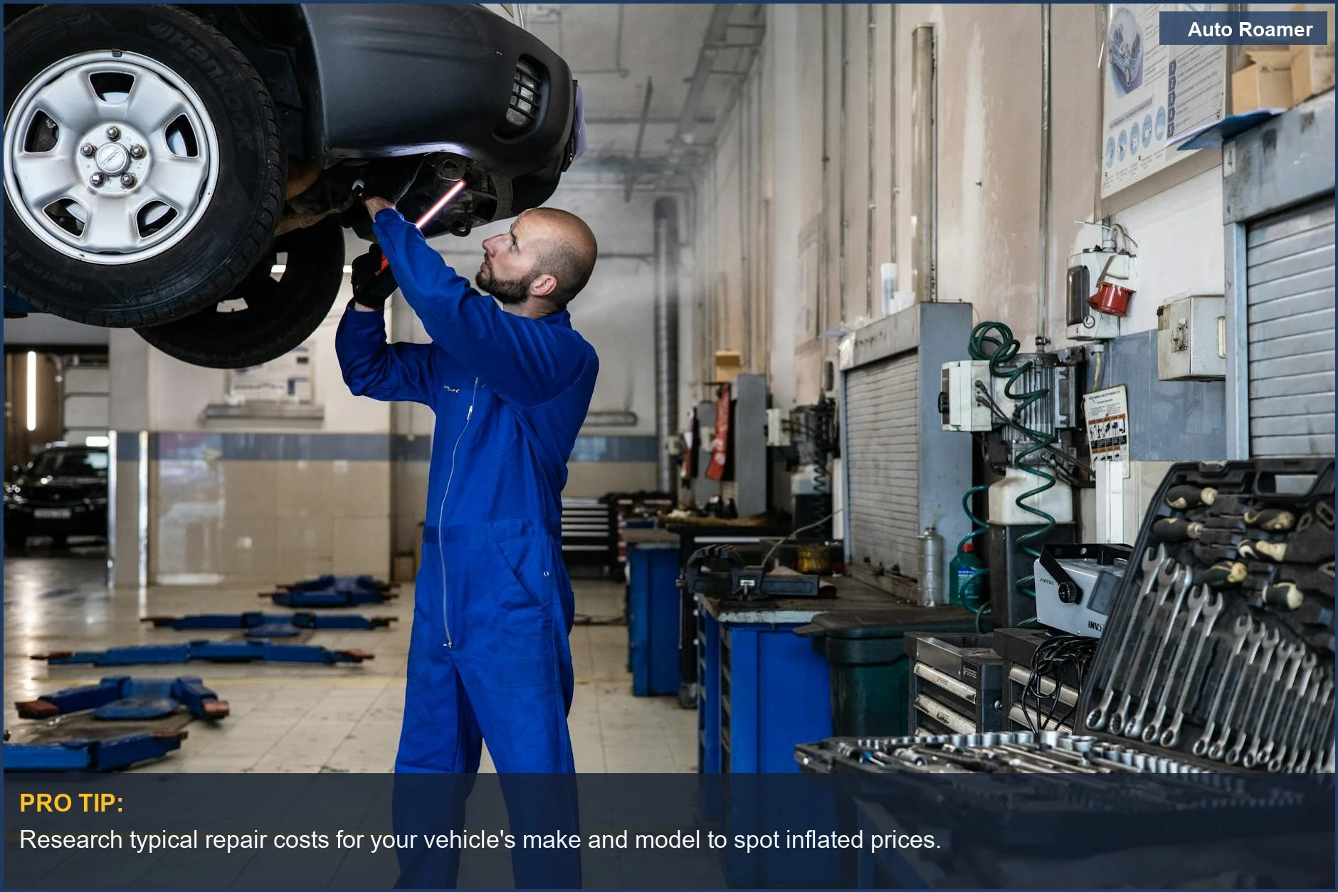 Close-up of a mechanic inspecting a car's undercarriage, a key area for common unnecessary maintenance.