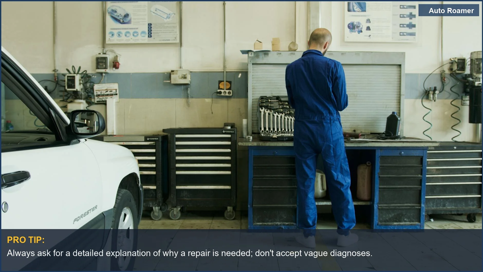 Auto mechanic examining a vehicle, a visual reminder of how common mechanic upsell scams can be.