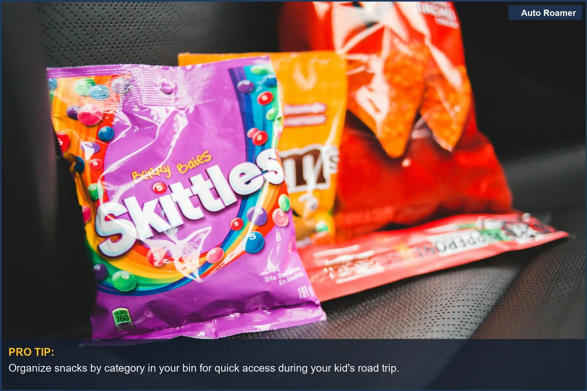 Colorful road trip snacks neatly arranged in a car's back seat, ready for kids.