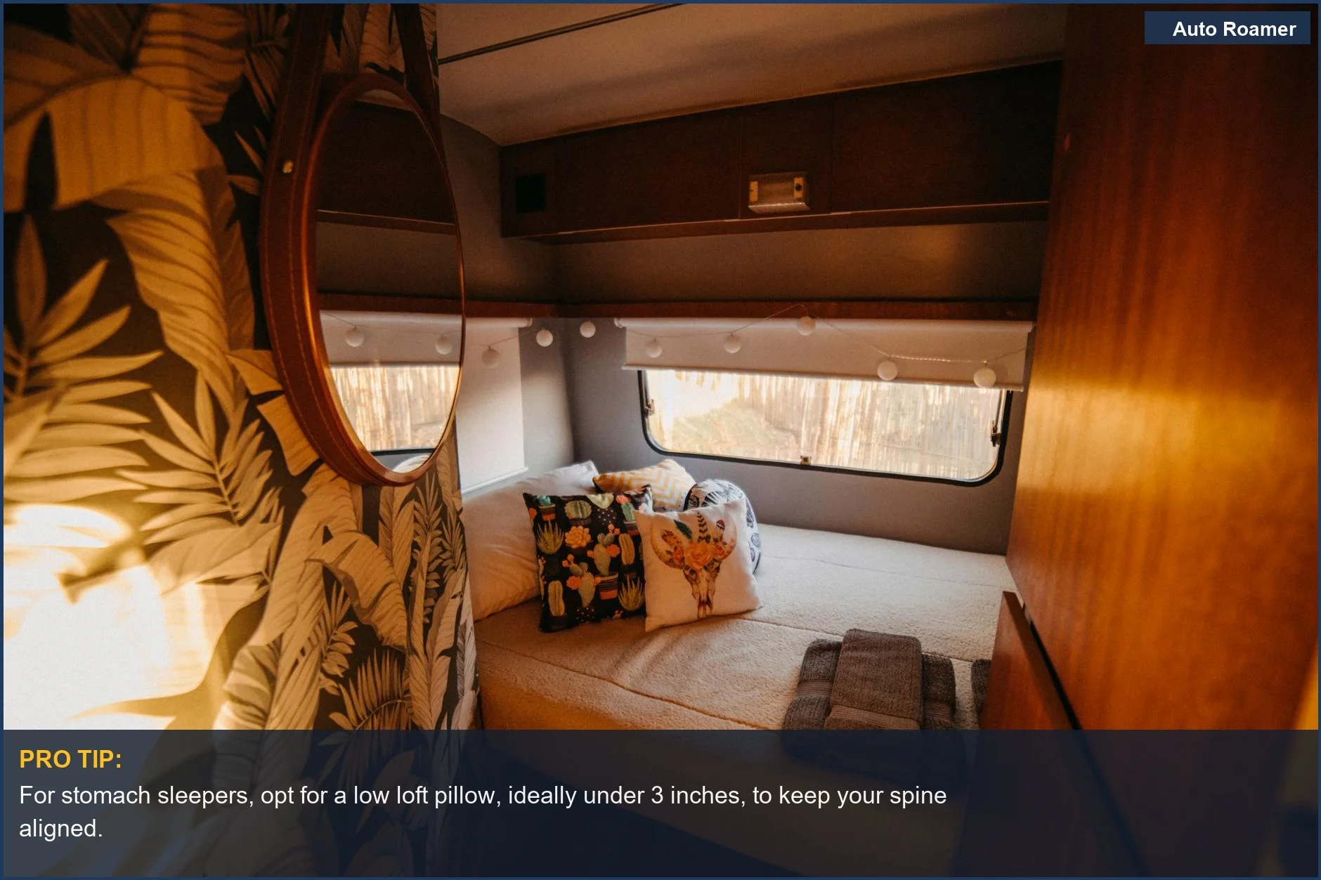 Stylish camper van interior with a cozy bed and decorative pillows, showcasing the benefits of a low loft pillow for stomach sleepers.